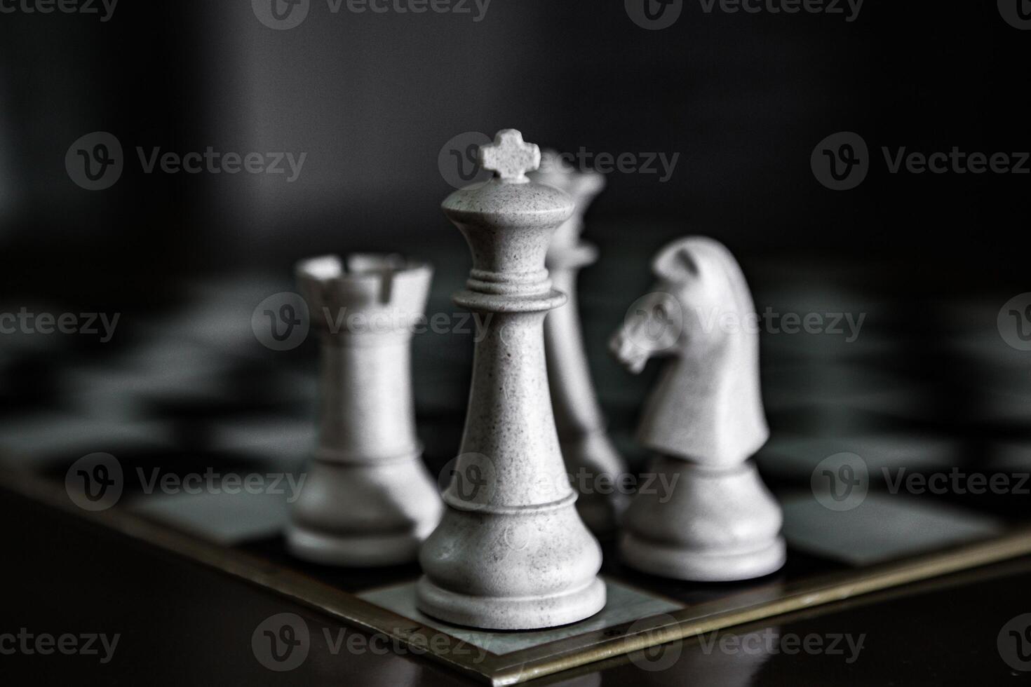 chess figures on black background photo