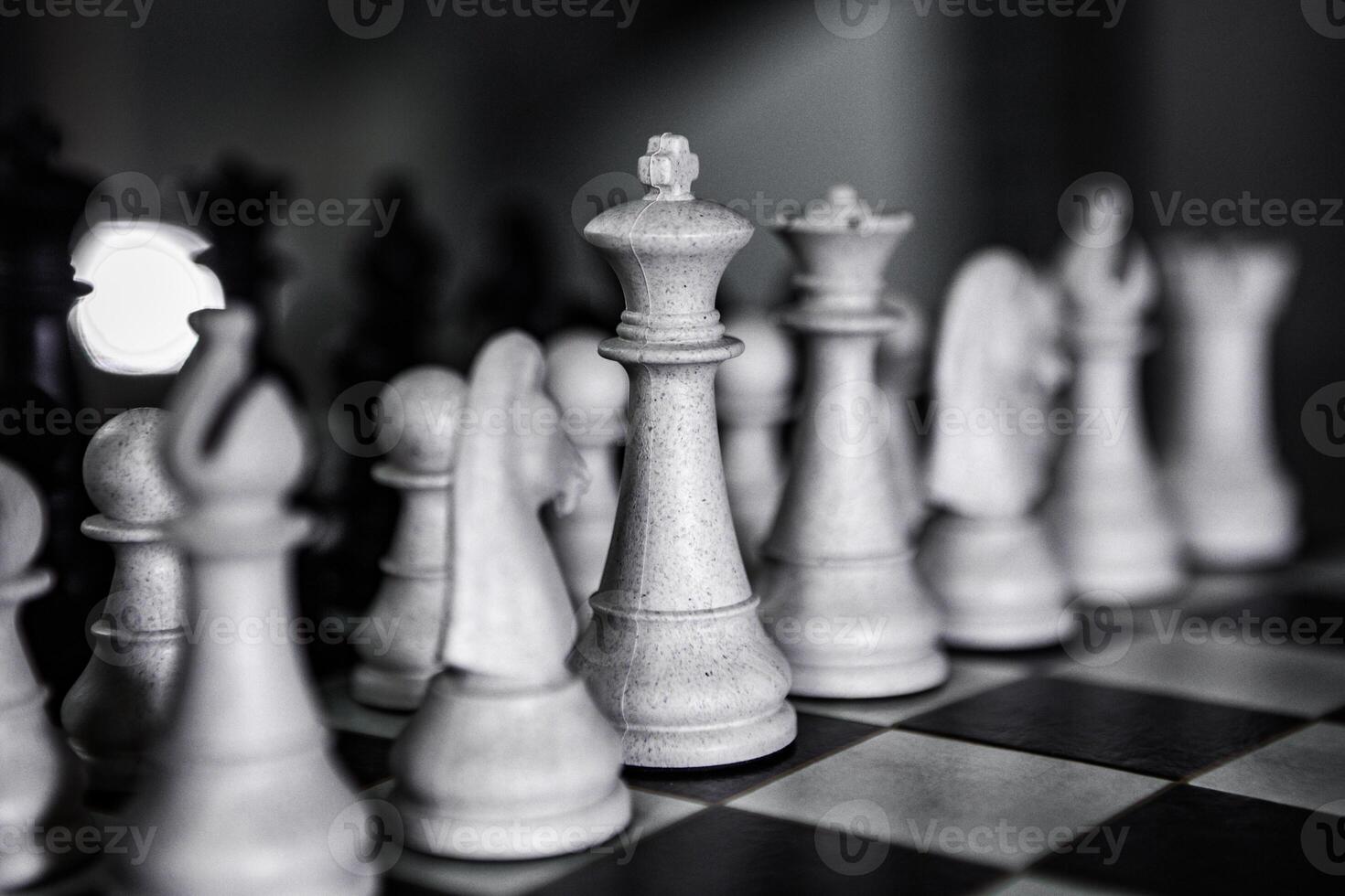 Close-up of a chessboard with dramatic lighting, representing strategic thinking, planning, and decision-making in business and life photo
