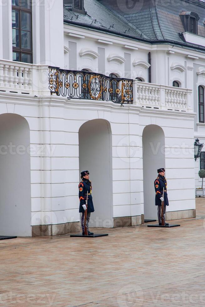 Presidential Guards standing at the Grassalkovich Palace in Bratislava photo