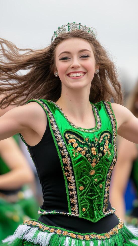 Dancer in green costume performing joyfully with flowing hair photo
