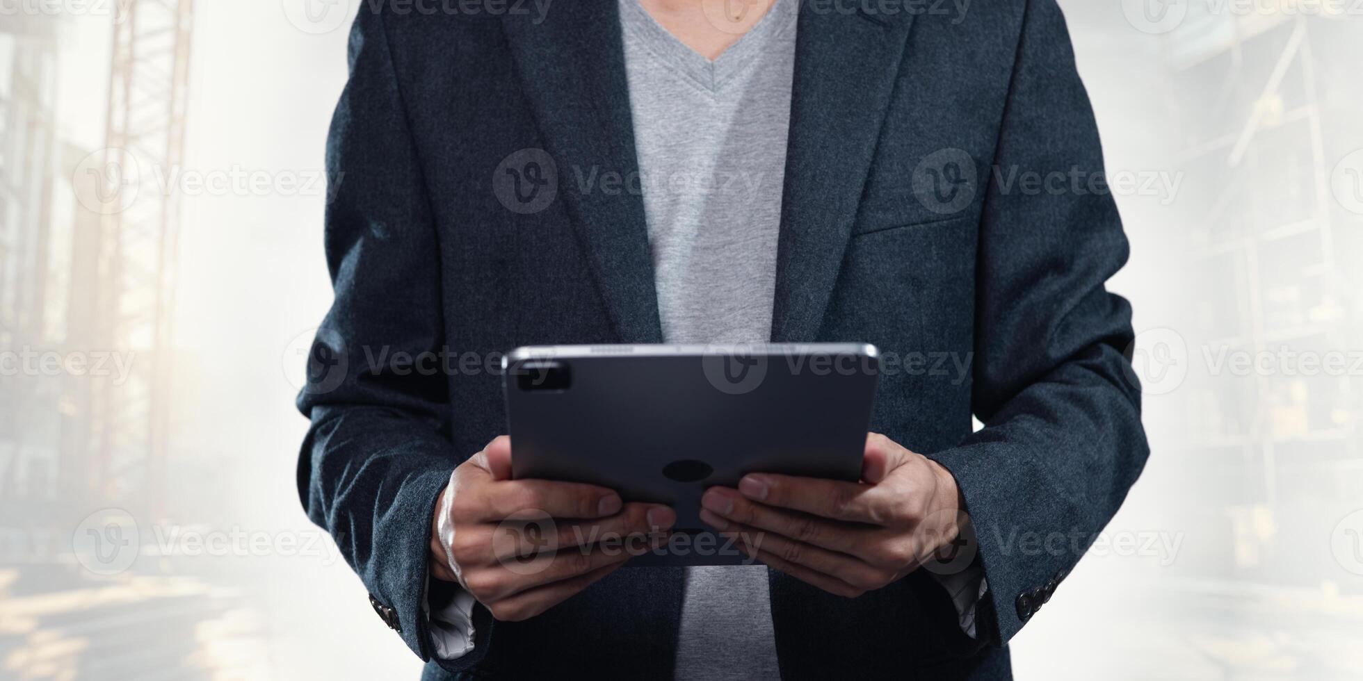 Business Professional Using Tablet in Construction Technology Setting photo