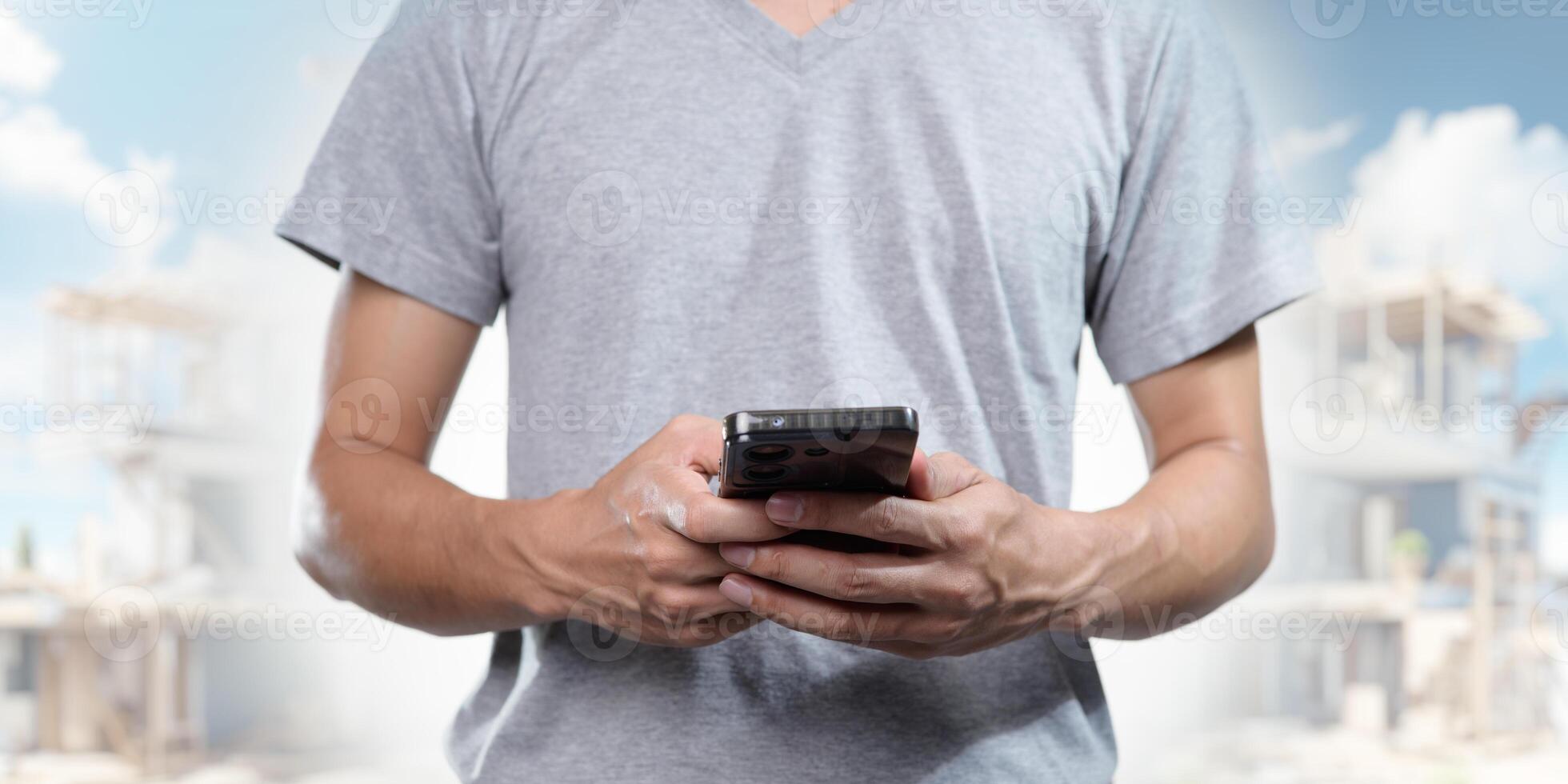 Construction Worker Using Smartphone on Job Site for Project Management photo