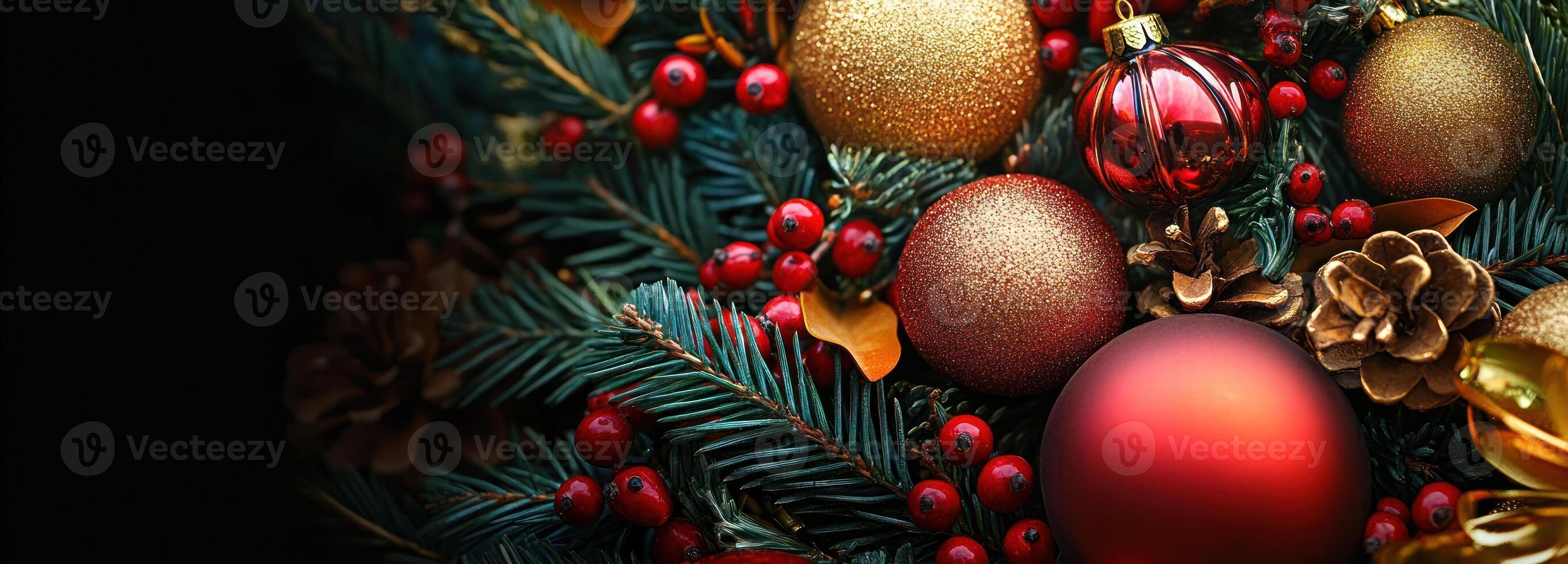 Close-up of red and gold Christmas ornaments, pine branches, and red berries photo