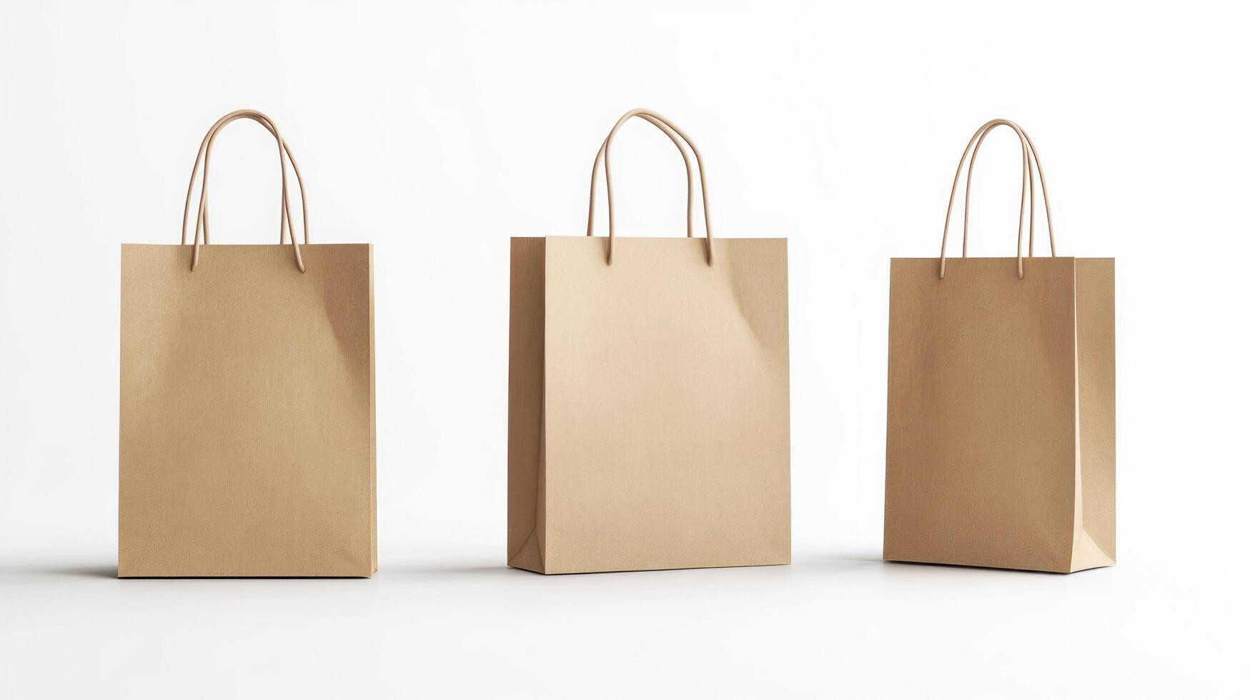 Three Brown Paper Bags with Twisted Handles on a White Background photo