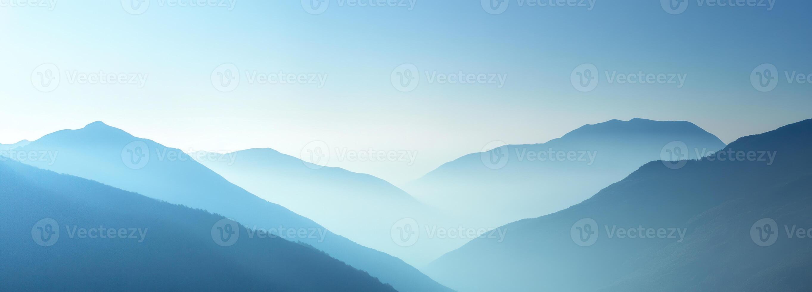 Misty Blue Mountain Range Under a Clear Sky photo
