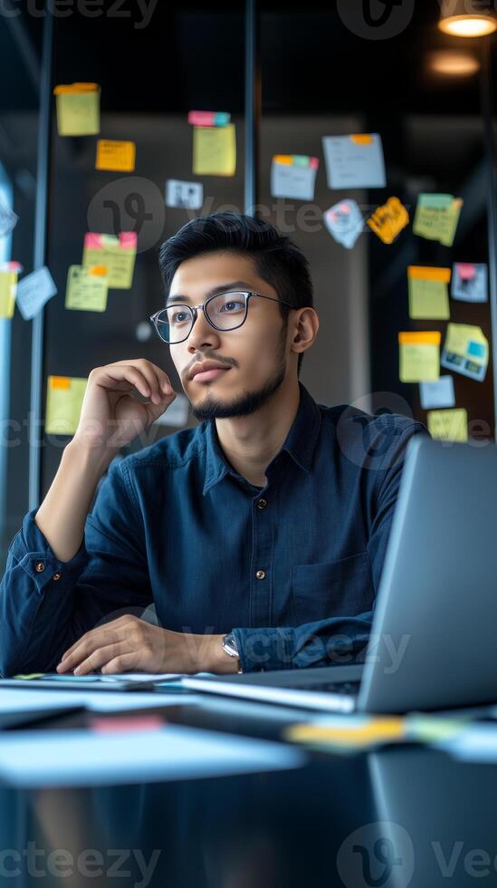 Stylish portrait of a young software developer engaging in work at a co-working space photo