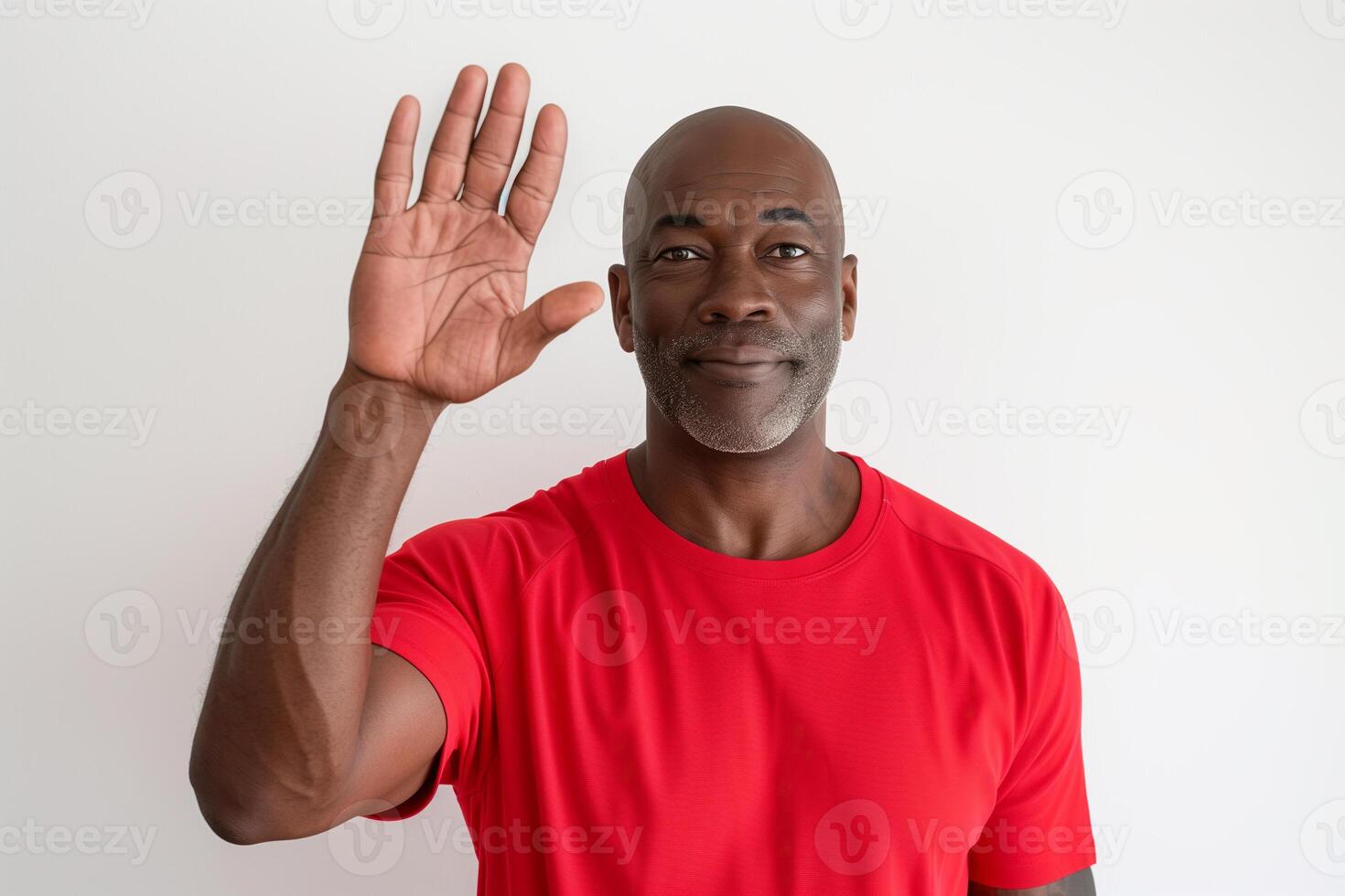 Middle-aged Black male trainer greeting while counting on fingers against isolated white background photo