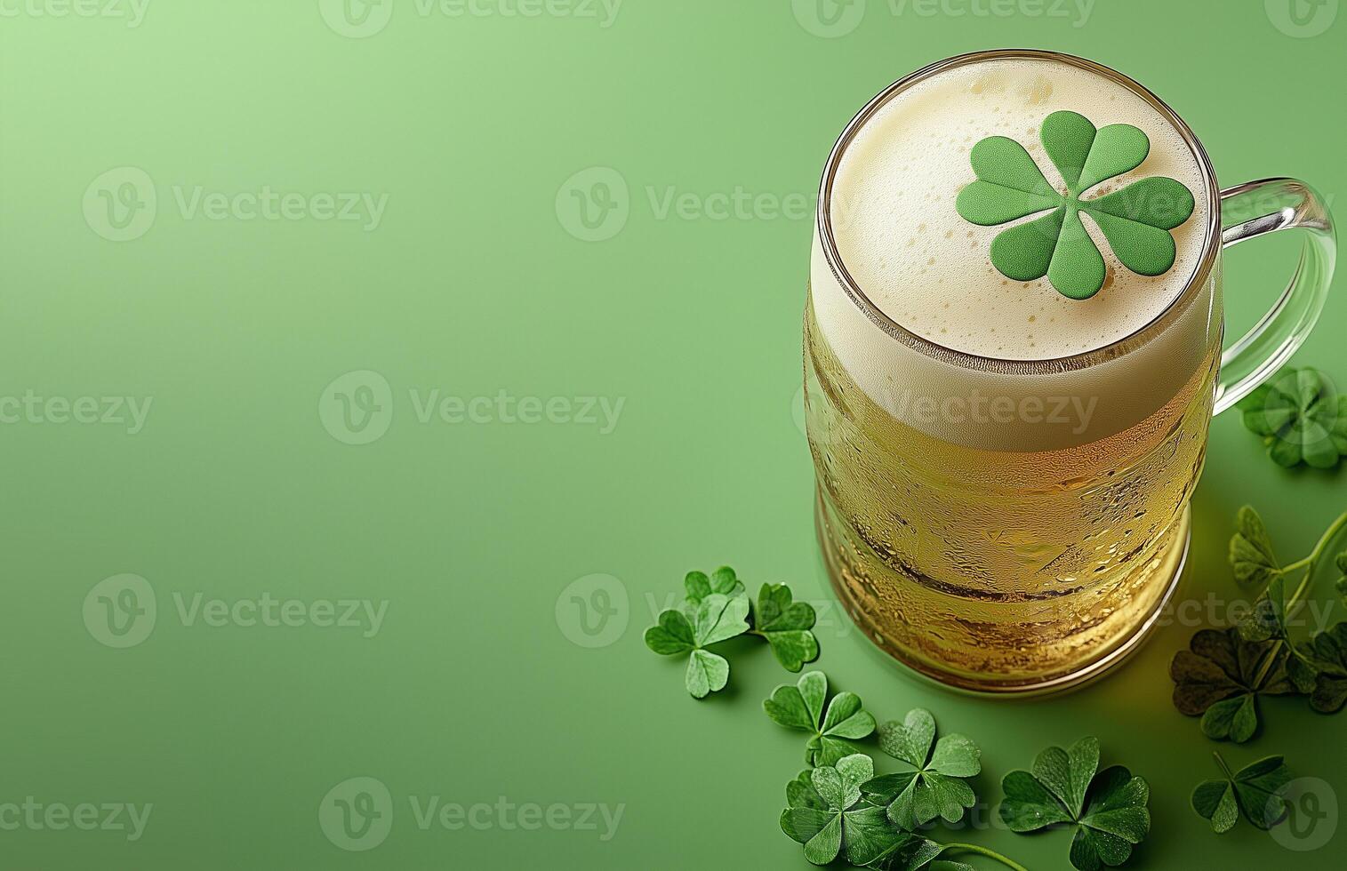 Fresh beer mug topped with clovers on a green background for St. Patrick's Day celebration photo