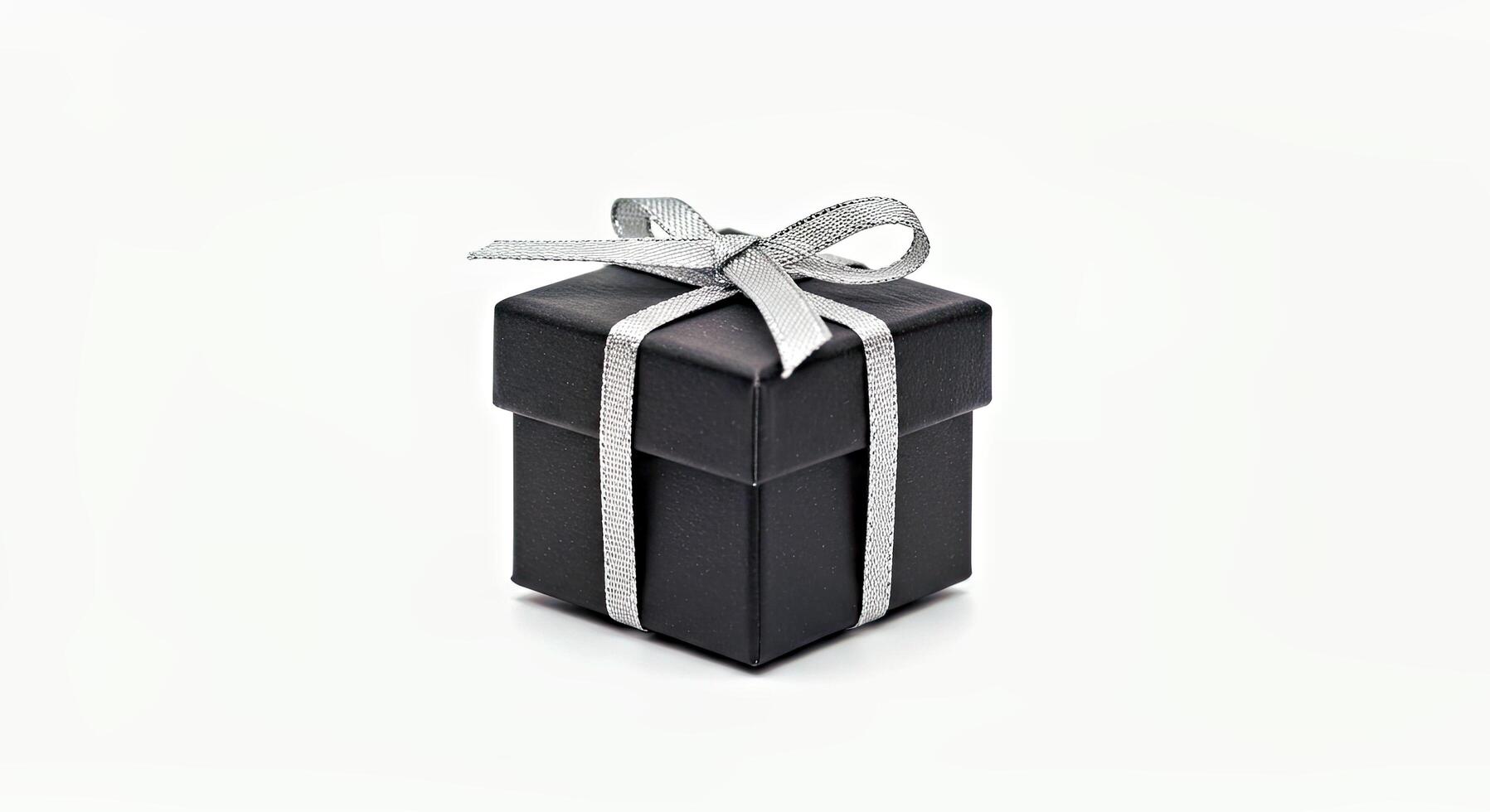 Black gift box with silver ribbon isolated on white background photo