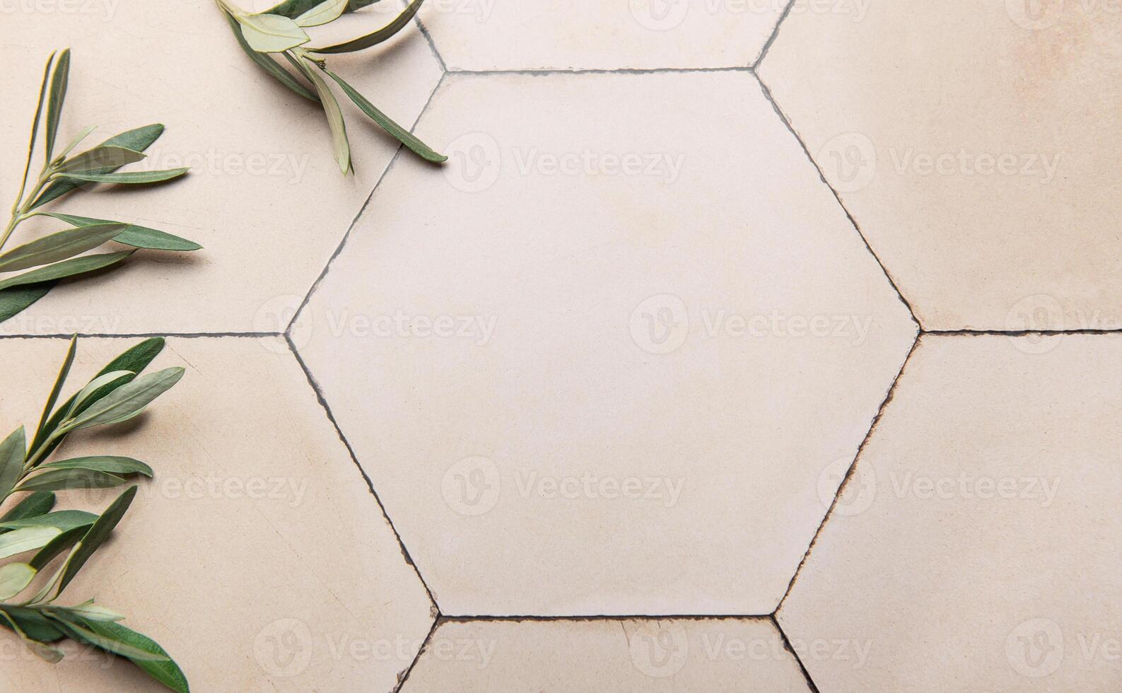 Olive branches framing hexagonal tiles background photo