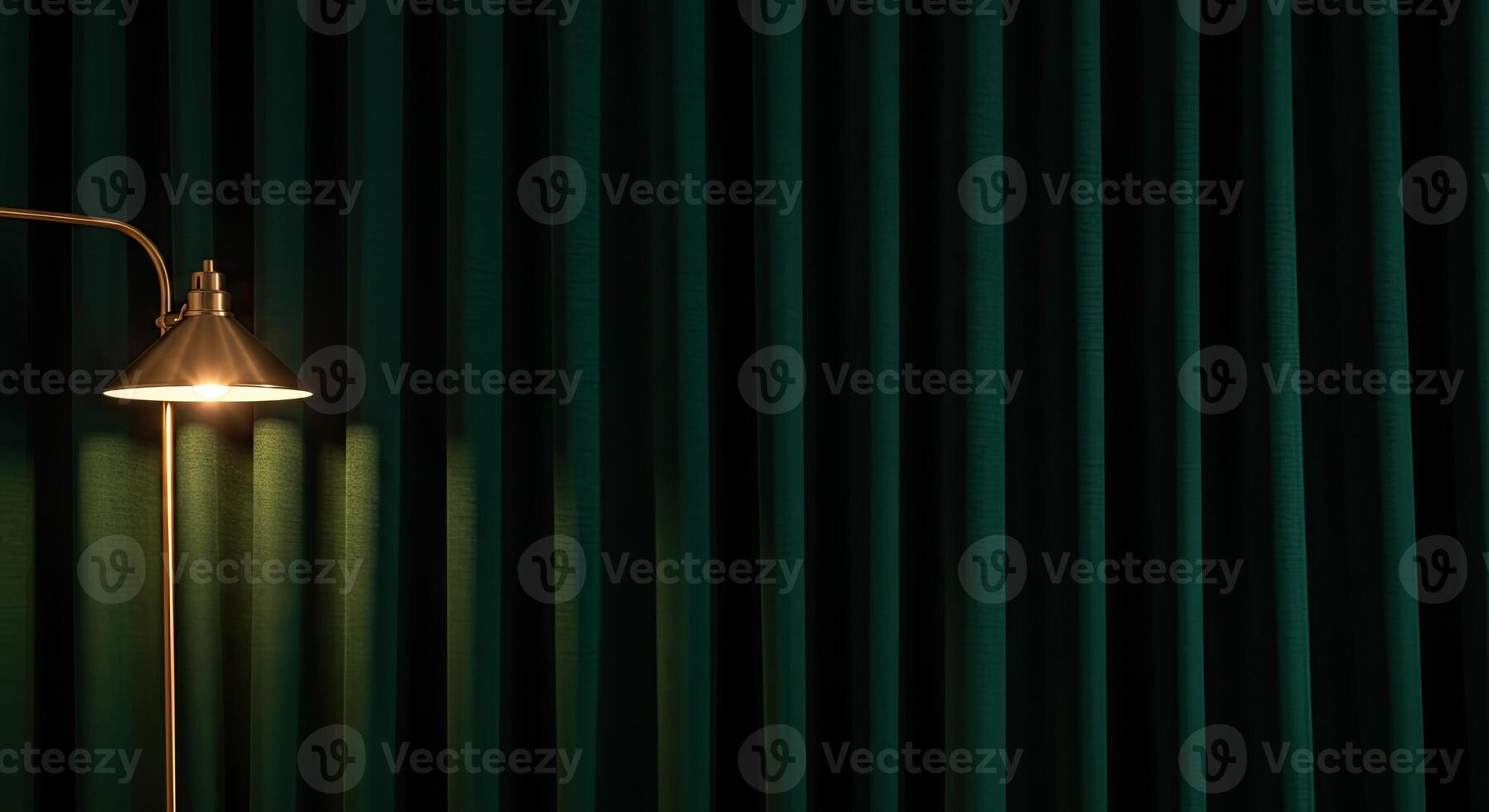 A lamp is sitting on a table next to a green curtain photo