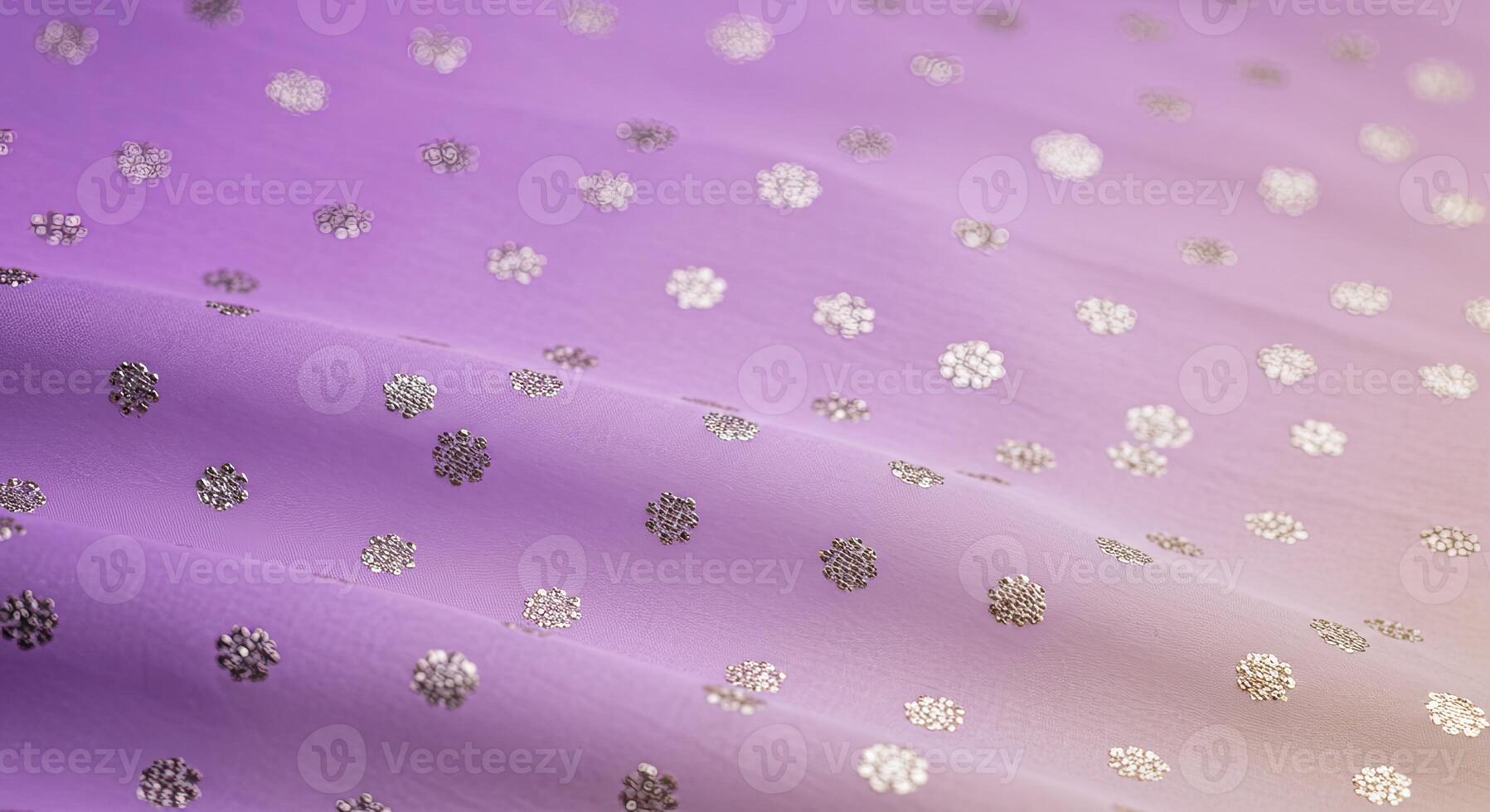 A close up of a purple and gold polka dot fabric photo
