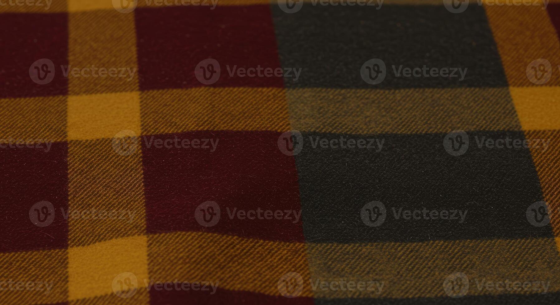 A close up of a red, yellow and black plaid fabric photo