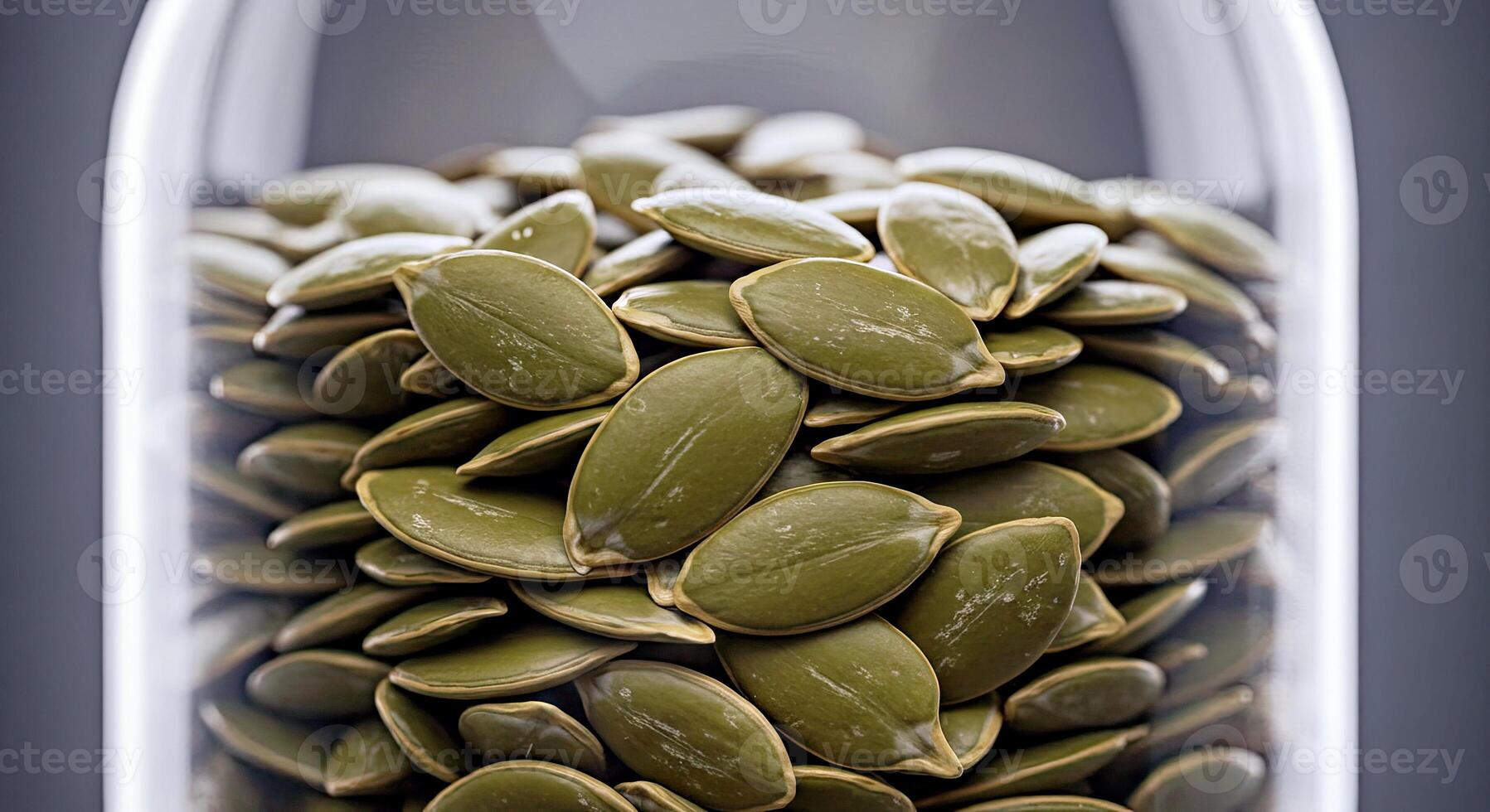 Pumpkin seeds in a glass jar photo