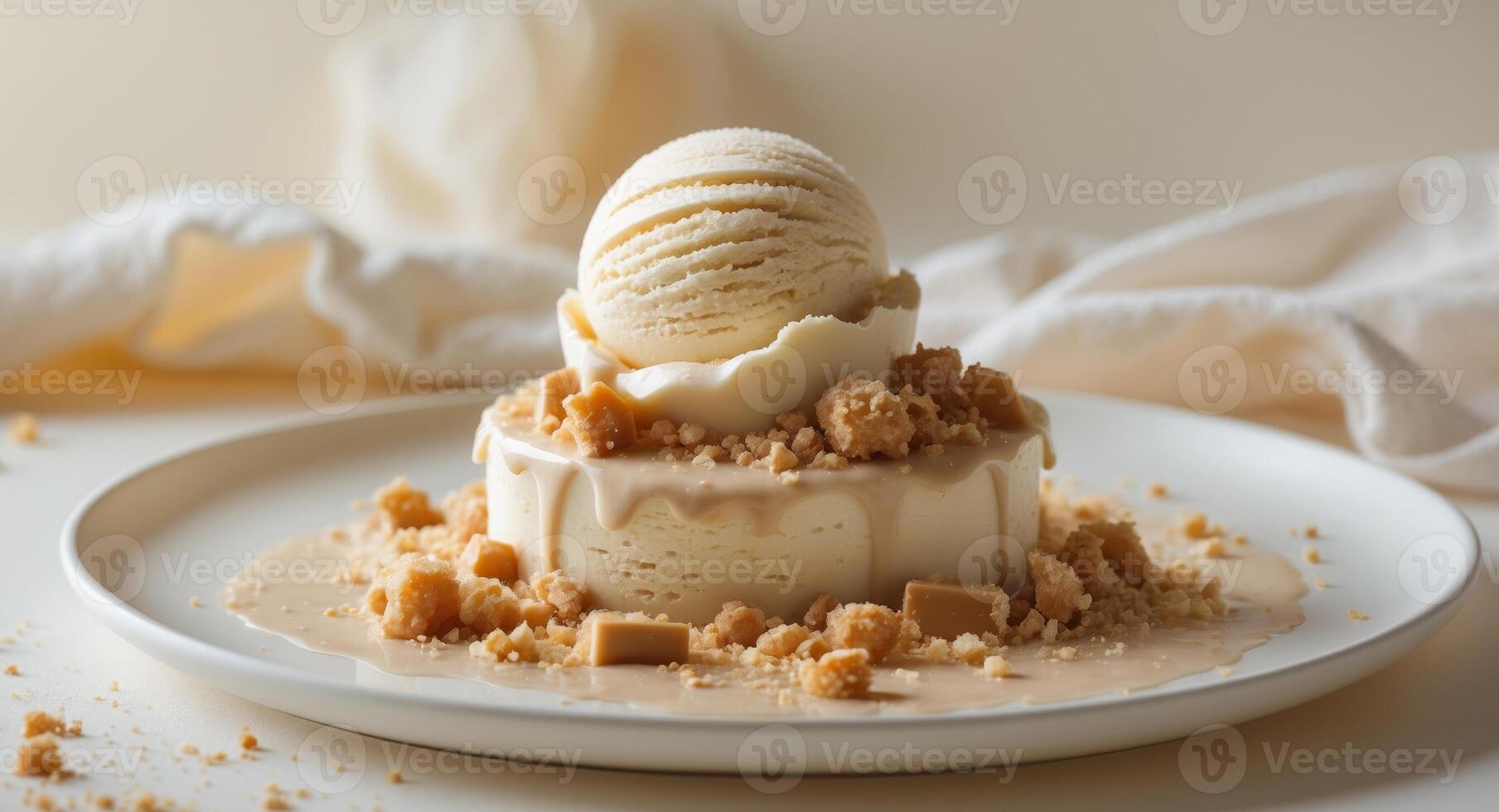 Creamy caramel dessert with ice cream and crumbles on plate. photo