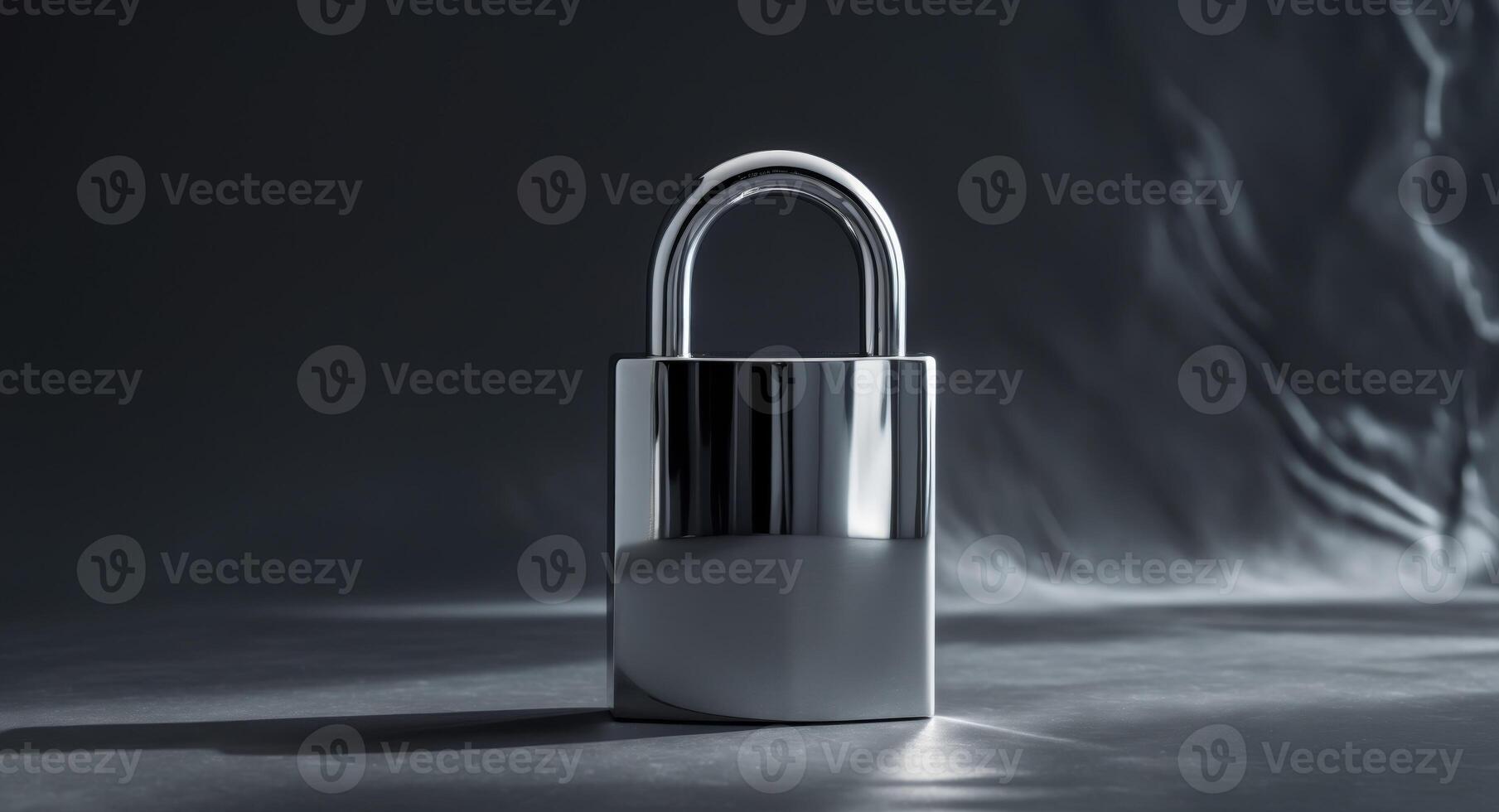 A shiny padlock resting on a dark background with shadows and texture photo