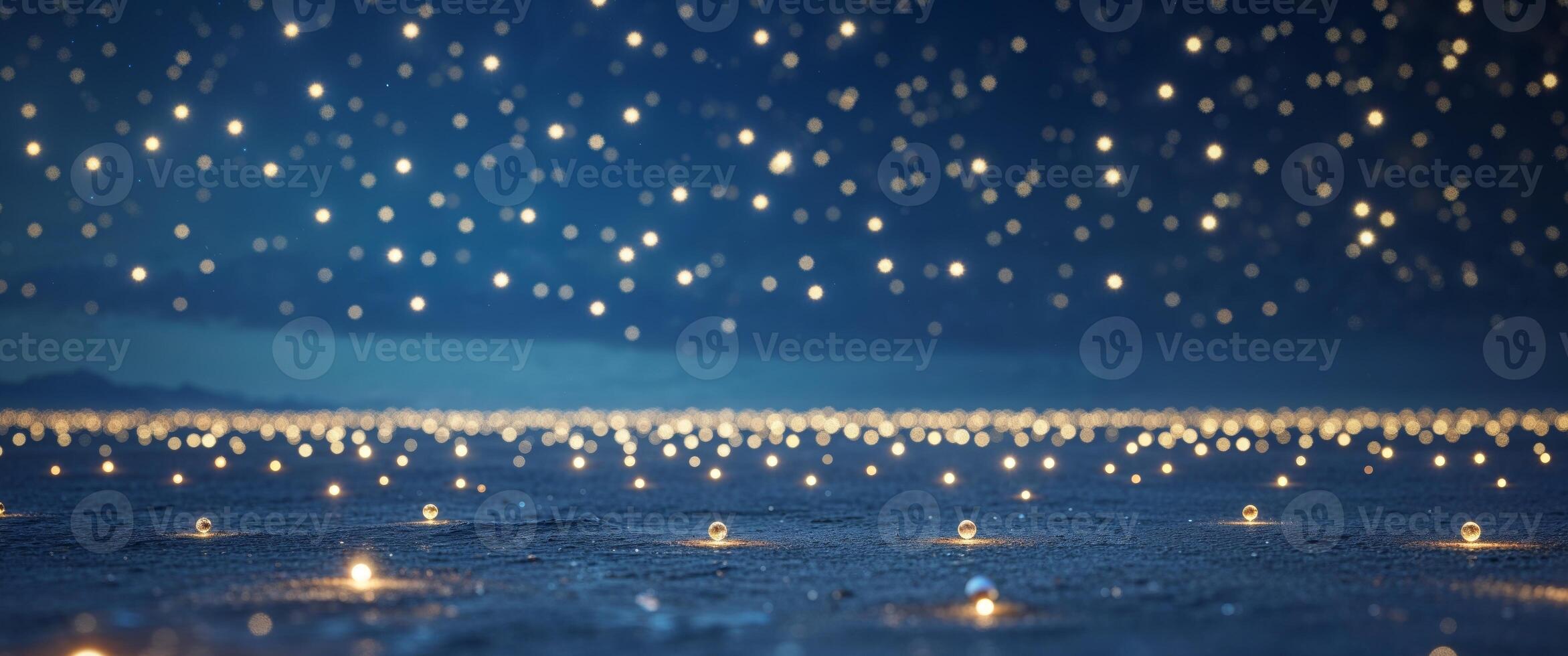 A field of candles lit up in the night sky photo