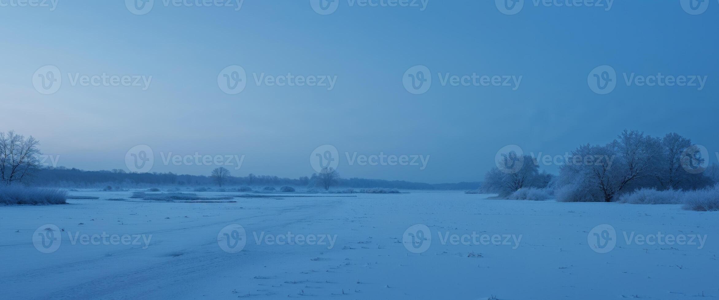 Blue Hour Stillness A deep twilight atmosphere with a soft blue tone covering the snow. photo