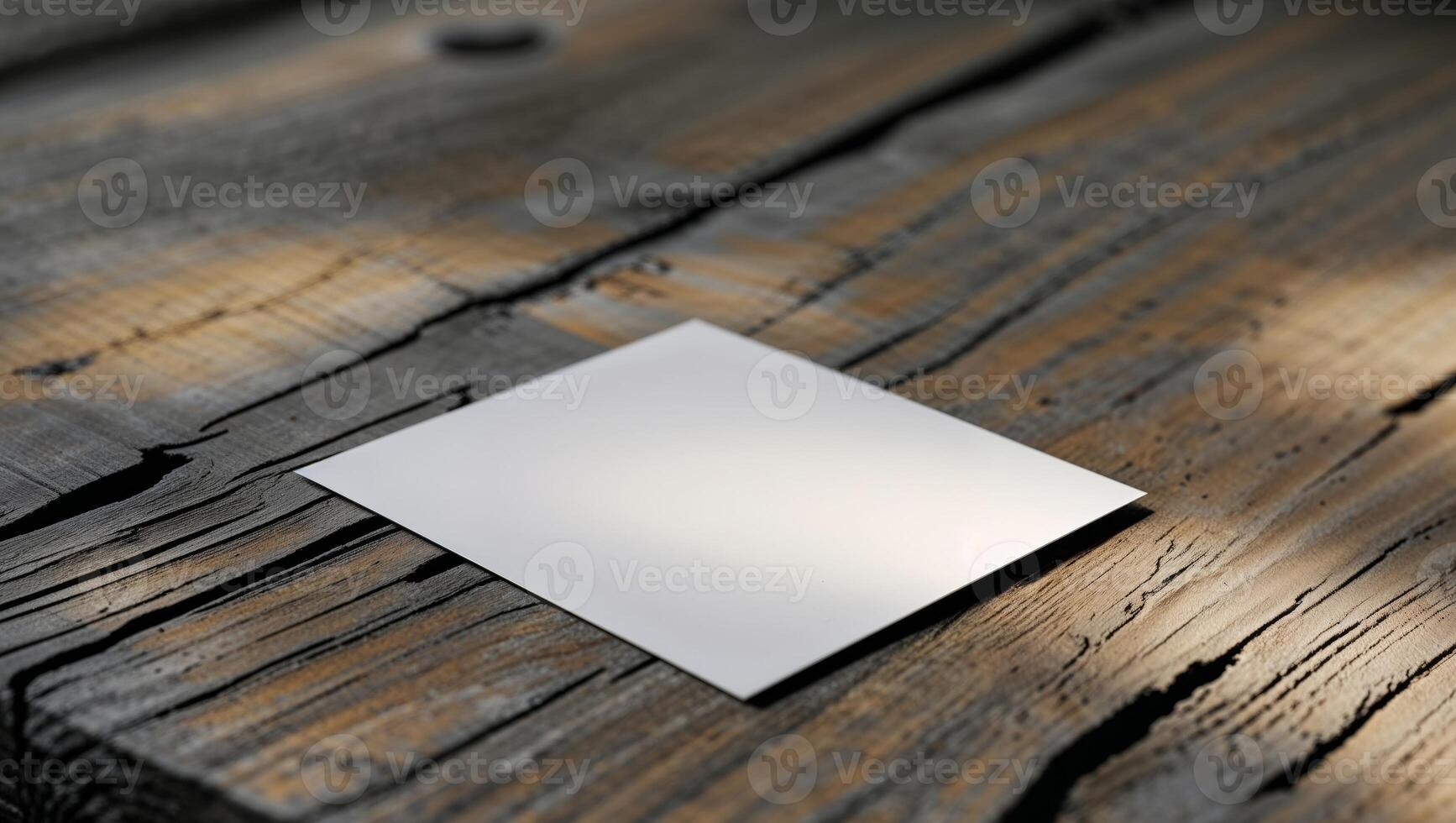 Blank Stationery Design Featuring a White Card on a Textured Wood Surface photo