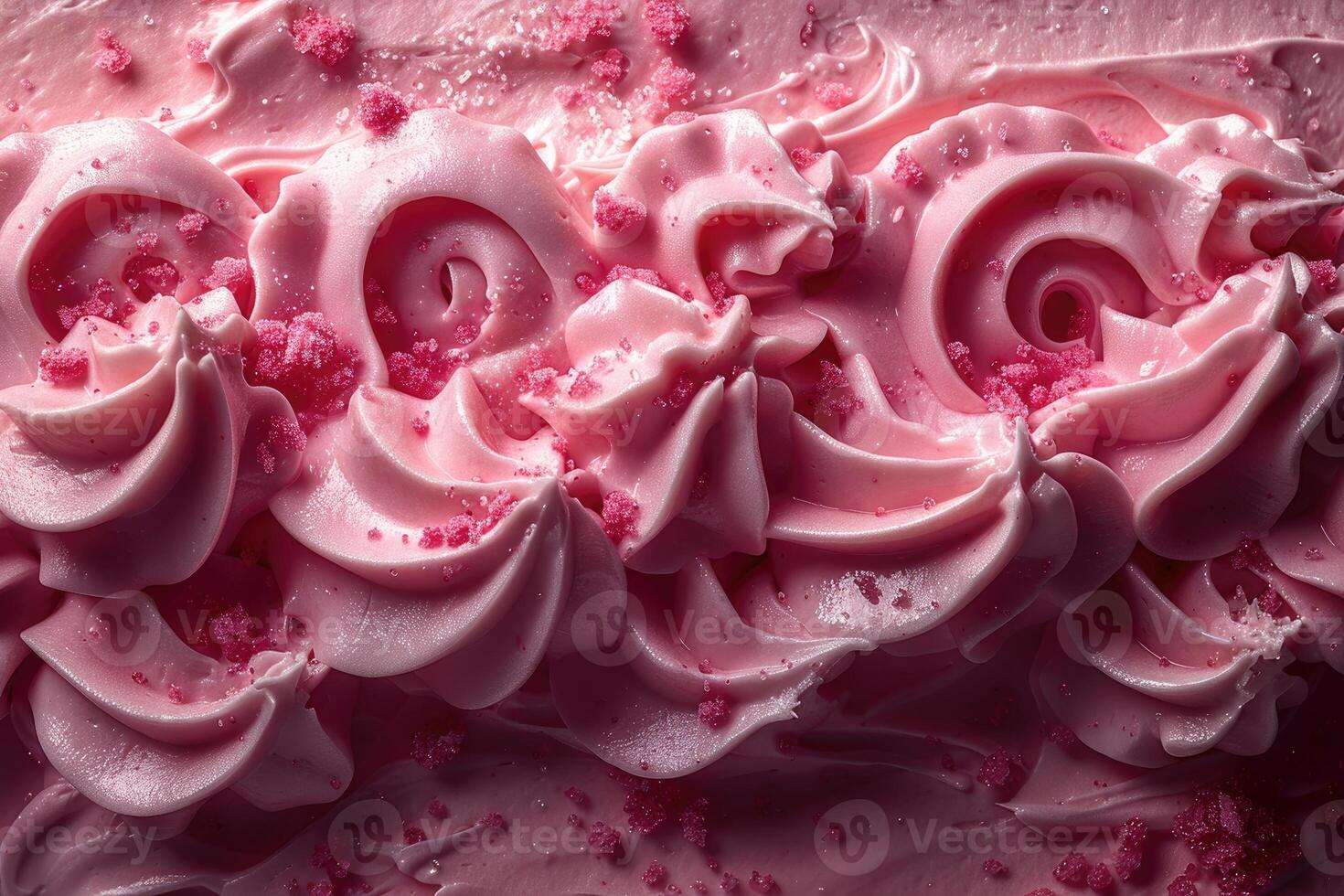 Pink frosting swirls with red sugar crystals photo