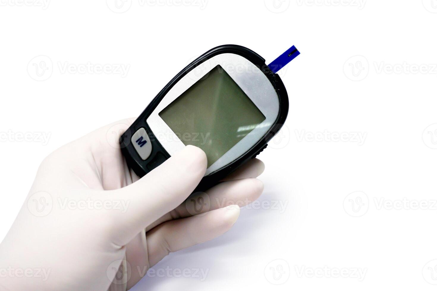 Hand of doctor in white medical glove holding glucose meter with sheet check isolate on white background photo