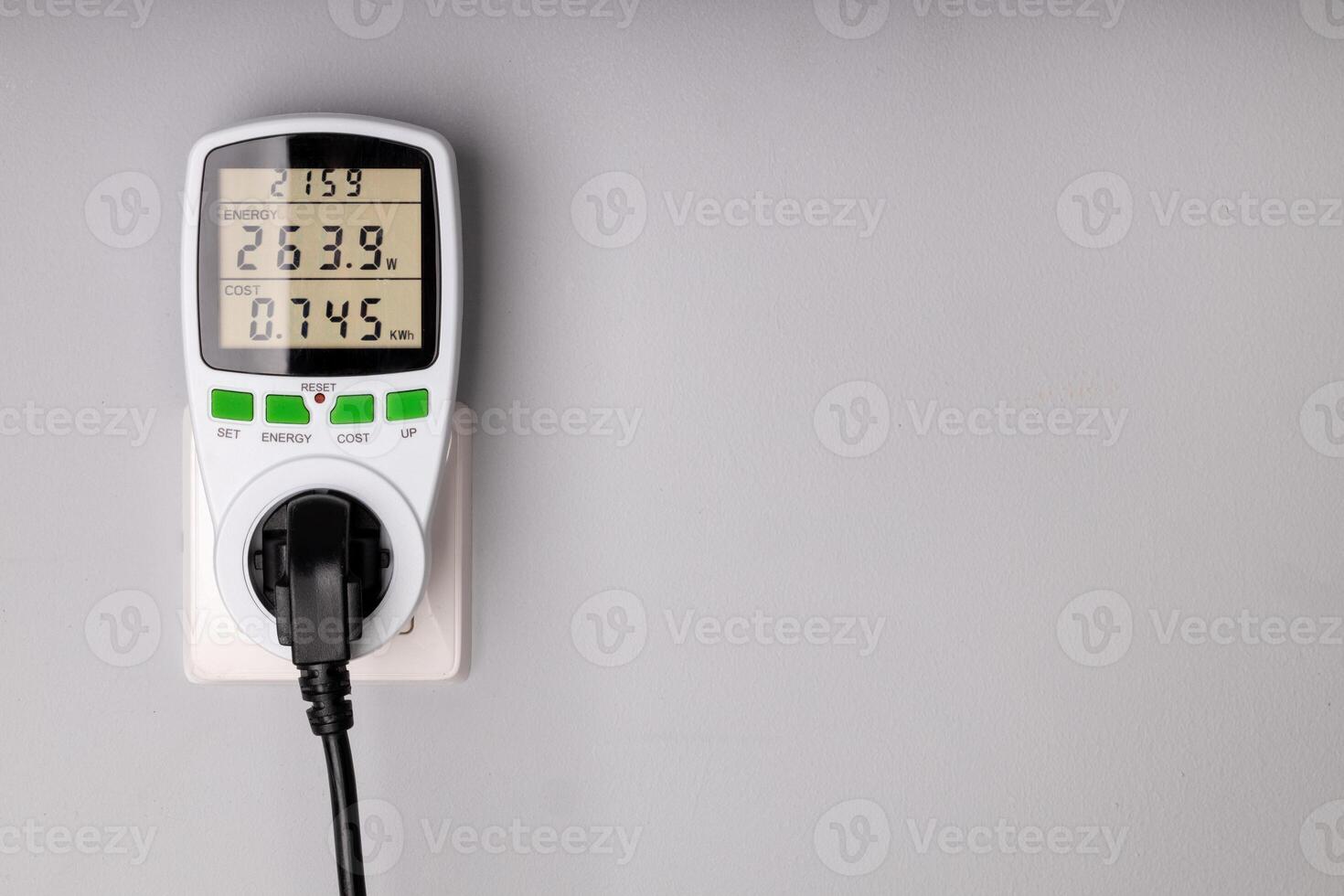 Energy Meter Measuring Power Consumption from Plugged in Device photo
