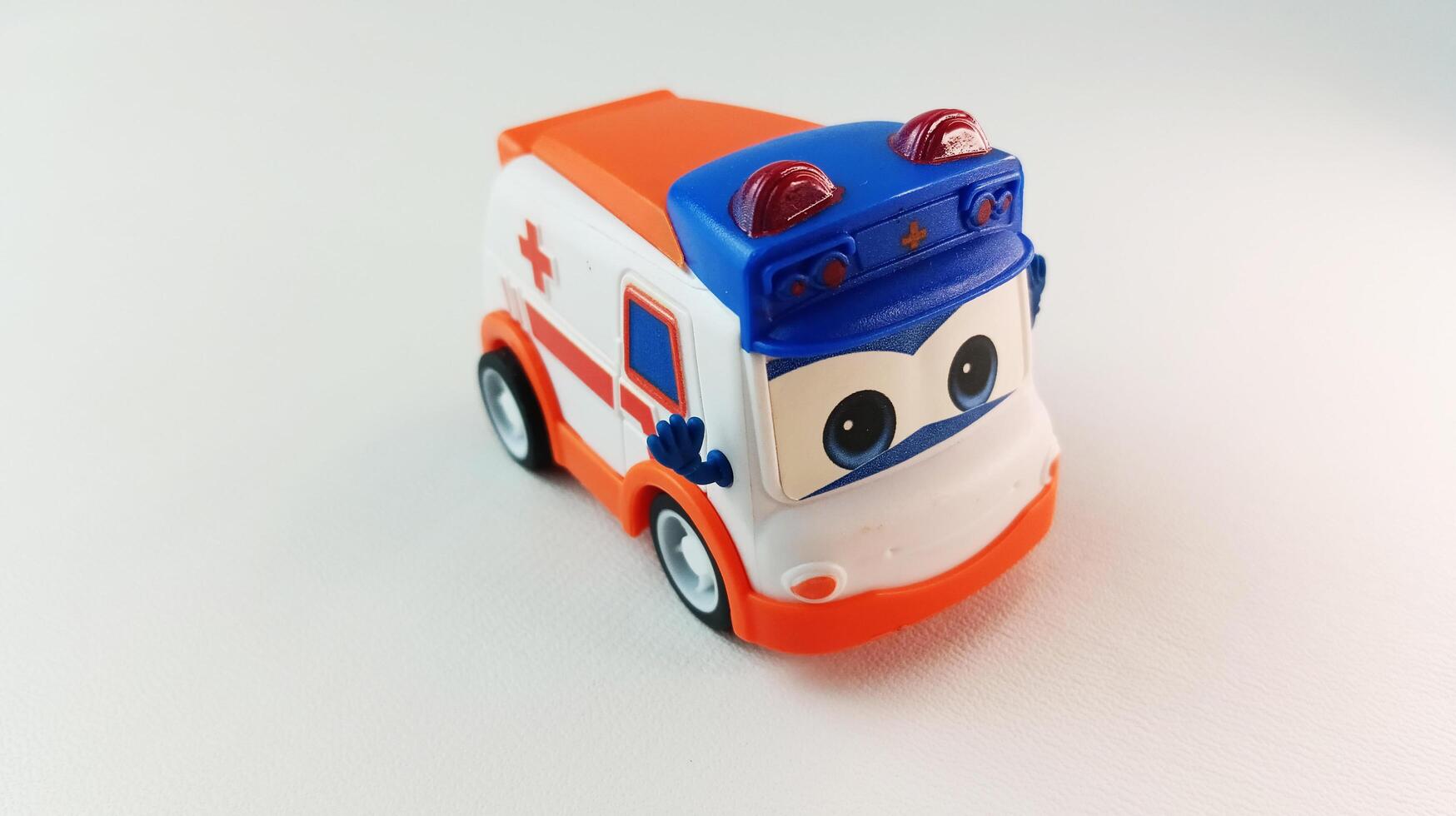 Full color bus-shaped children's toy, front view - Semarang, February 21, 2025. photo