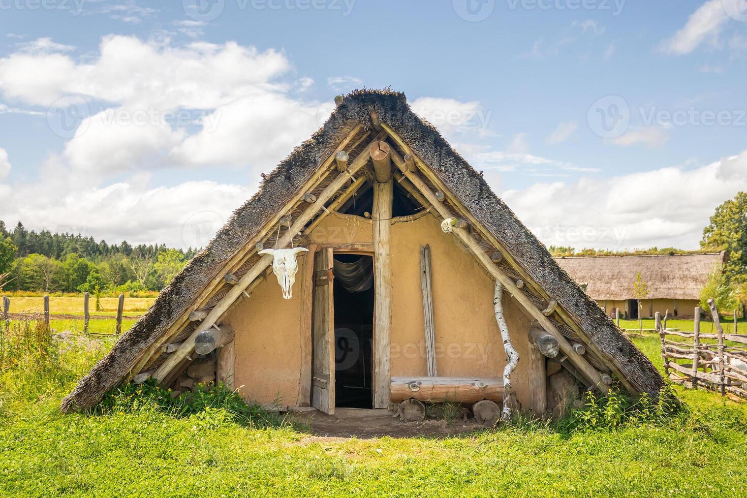 Celtic house with straw thatched roof at Celtic open air museum in Nasavrky Czech republic photo