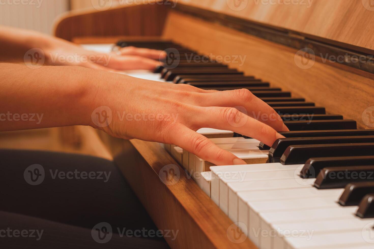 pianist playing the piano, hands and keys photo