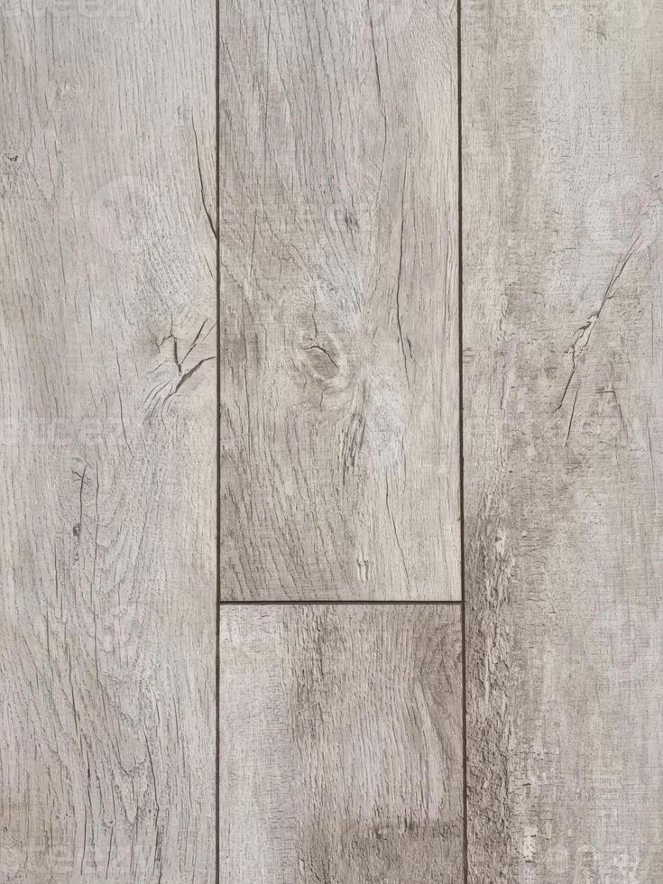 A close-up shot showcasing a gray wooden floor, highlighting the texture and pattern of the wood grain. Ideal for backgrounds or textures. photo