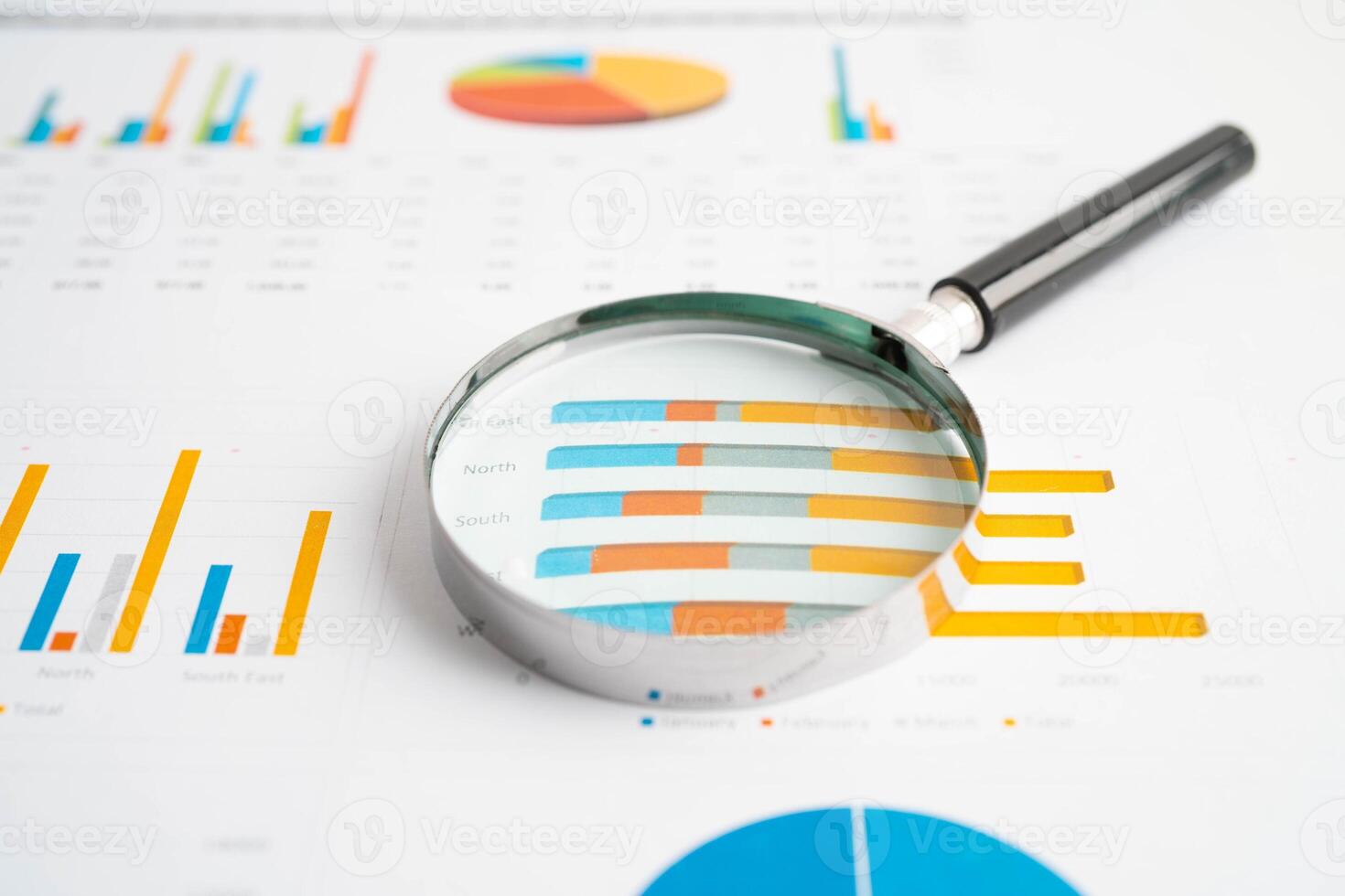 Magnifying glass on charts graphs paper. Financial development, Banking Account, Statistics, Investment Analytic re photo