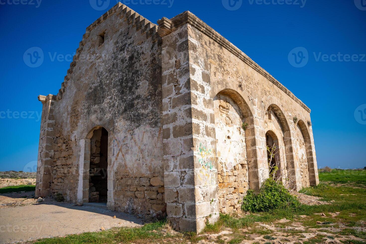 An old Orthodox church in ruins stands by the sea on the northern coast of Cyprus. The image reflects history, faith, and the passage of time in a coastal Mediterranean setting. High quality photo