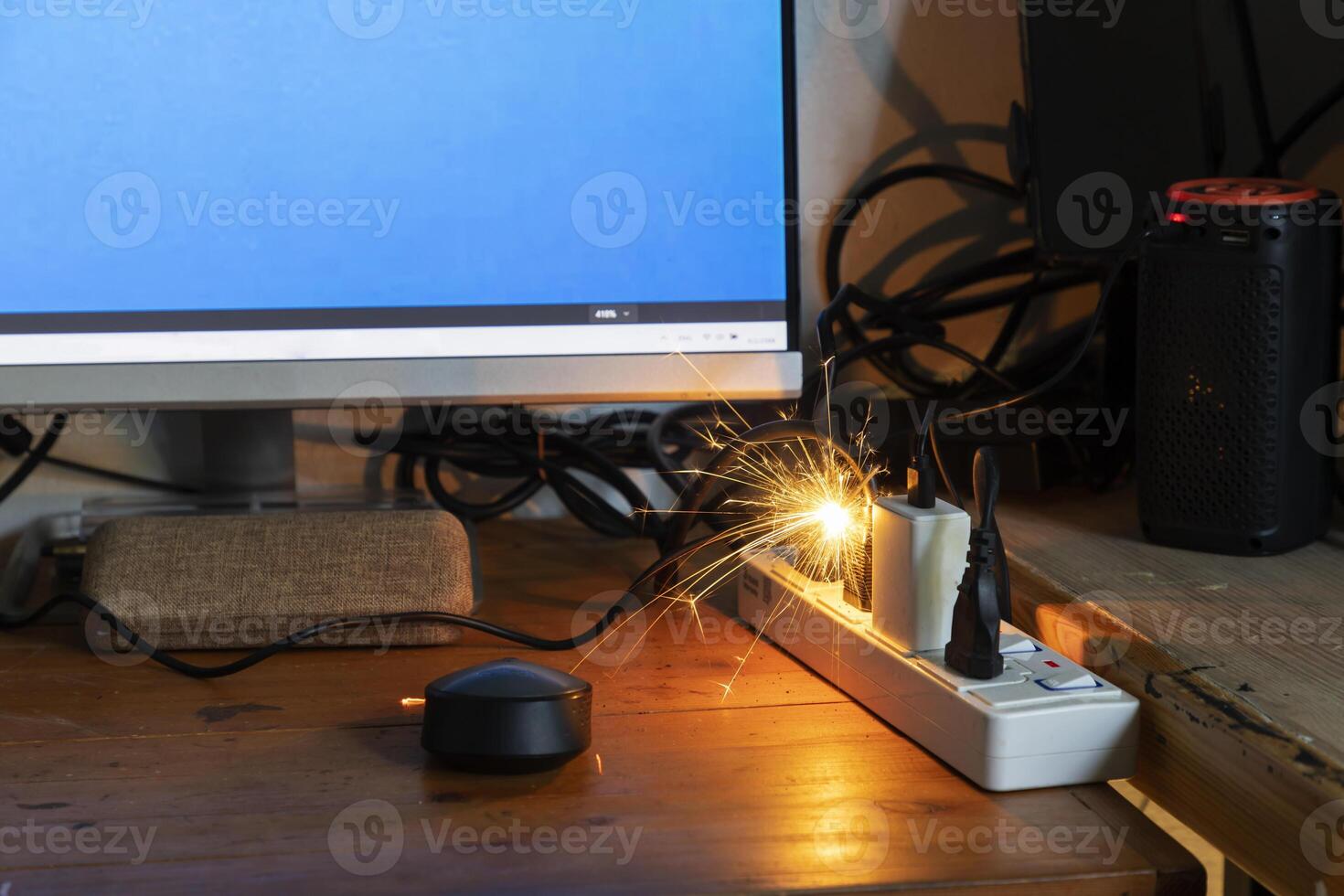 electric plug sparks Caused by short circuit The concept of danger, the use of non-standard equipment worn-out equipment. photo