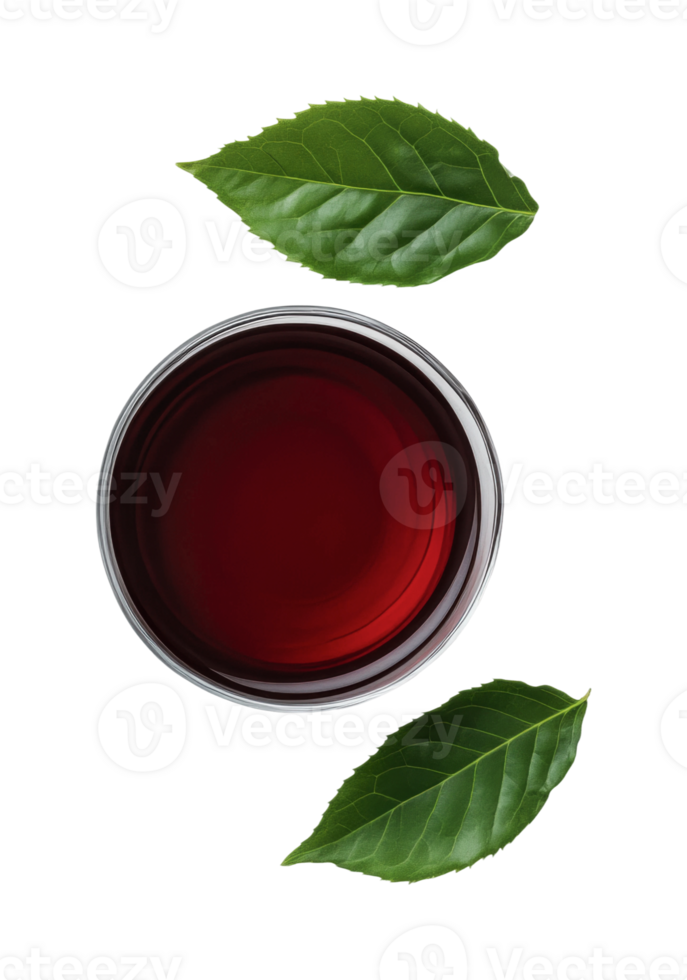 Top view of red beverage in glass with green leaves on black background png