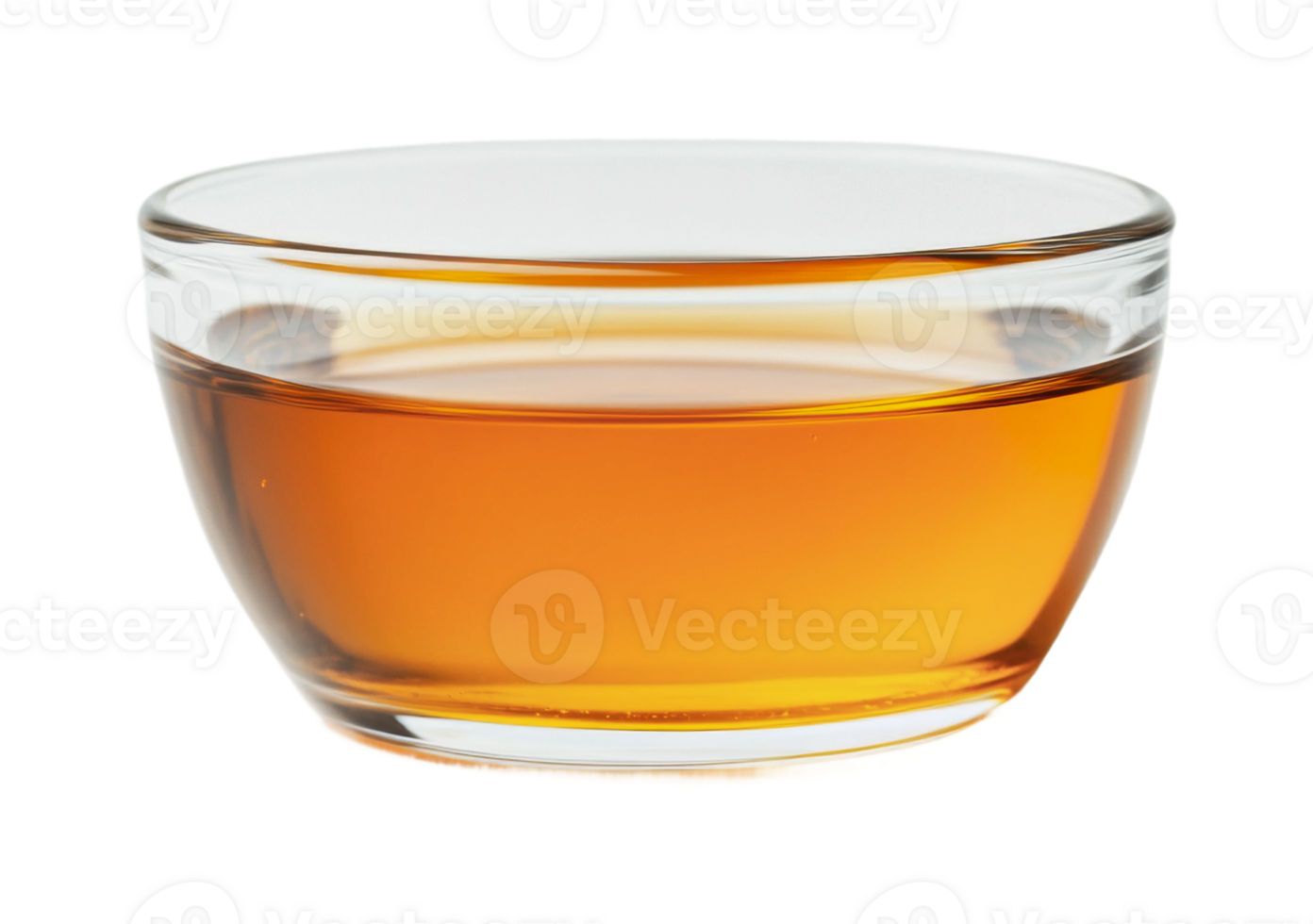 Glass bowl with amber liquid on white background png