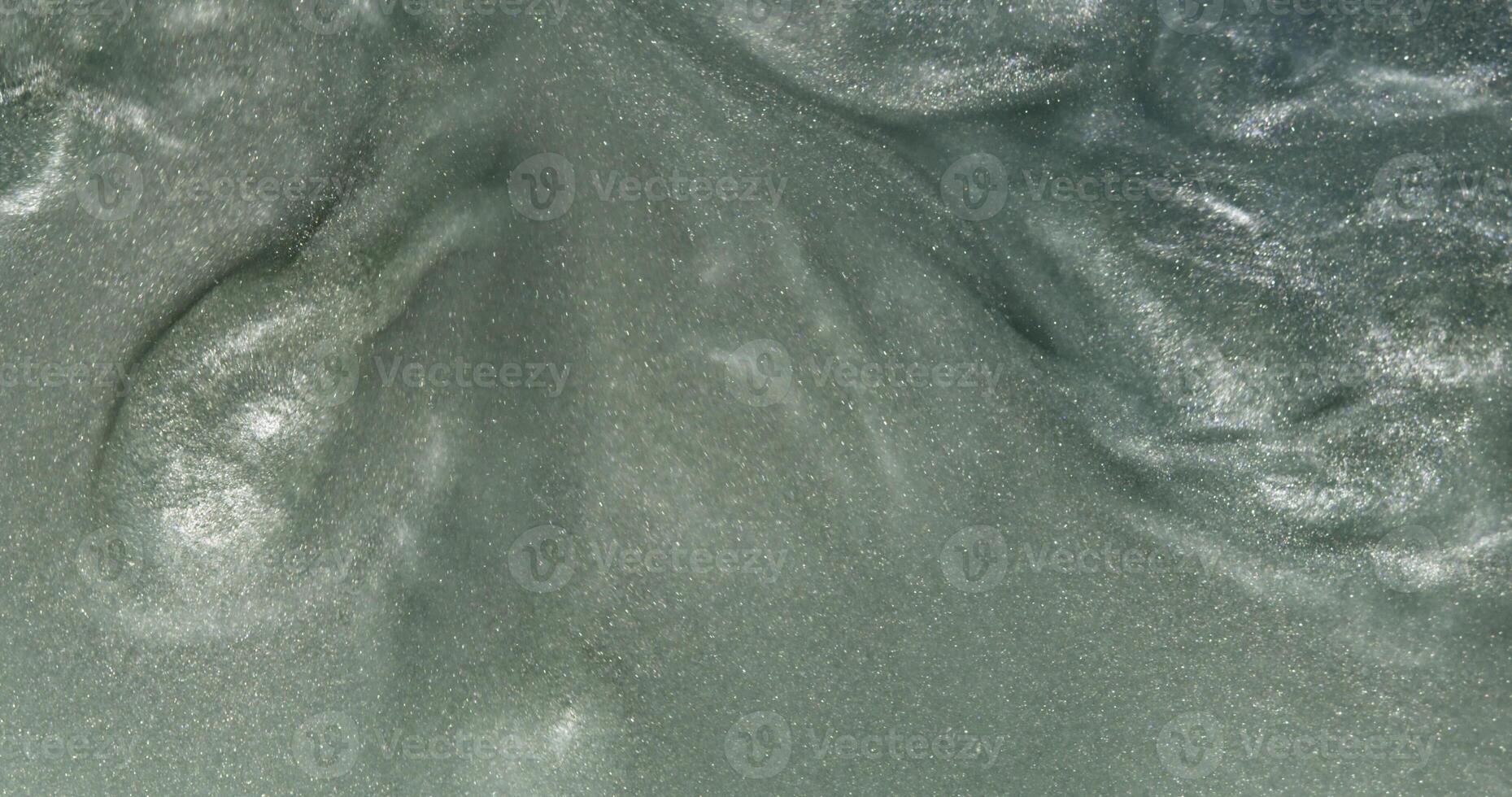 A close up of a green substance on a surface photo