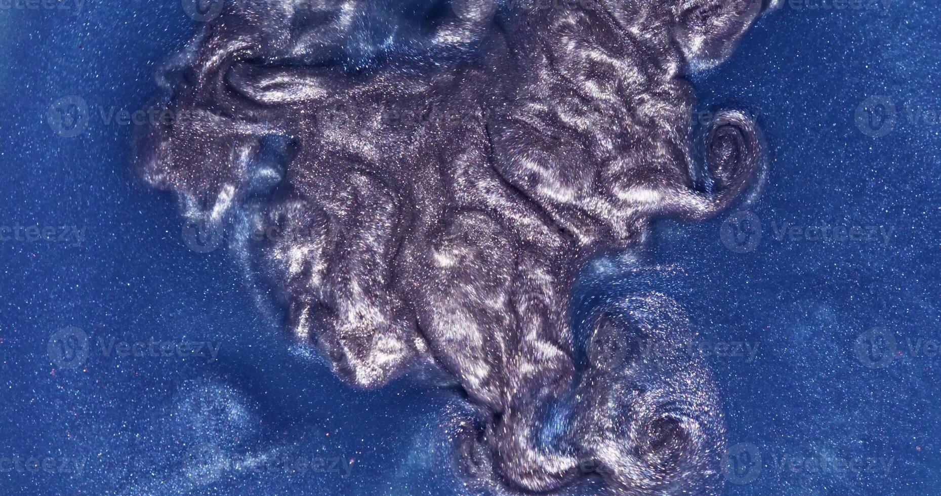A close up of a blue liquid on a surface photo