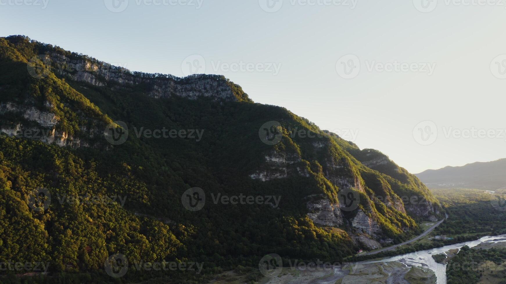 A peaceful valley with a winding river photo