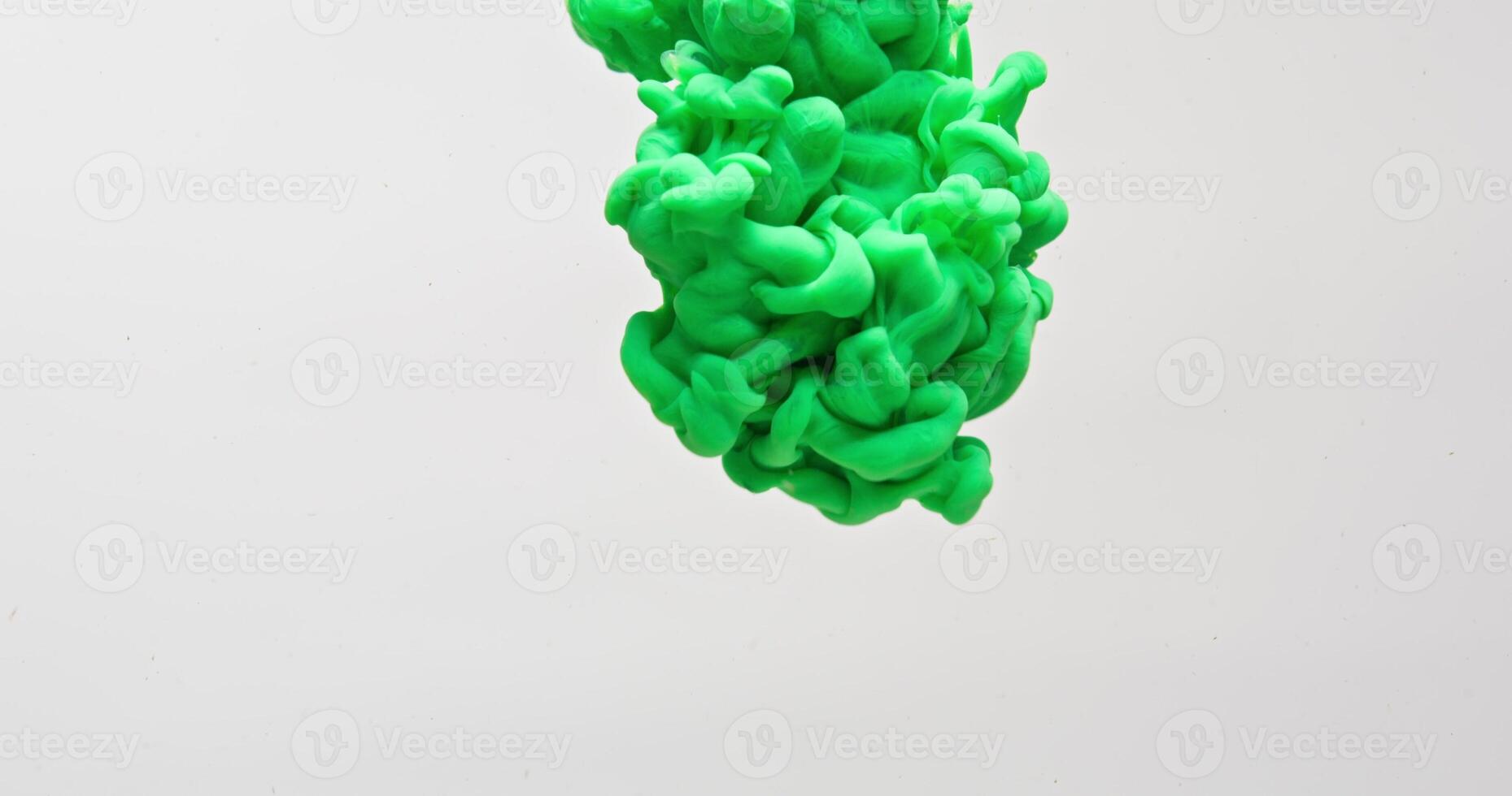 A water is filled with green liquid. photo