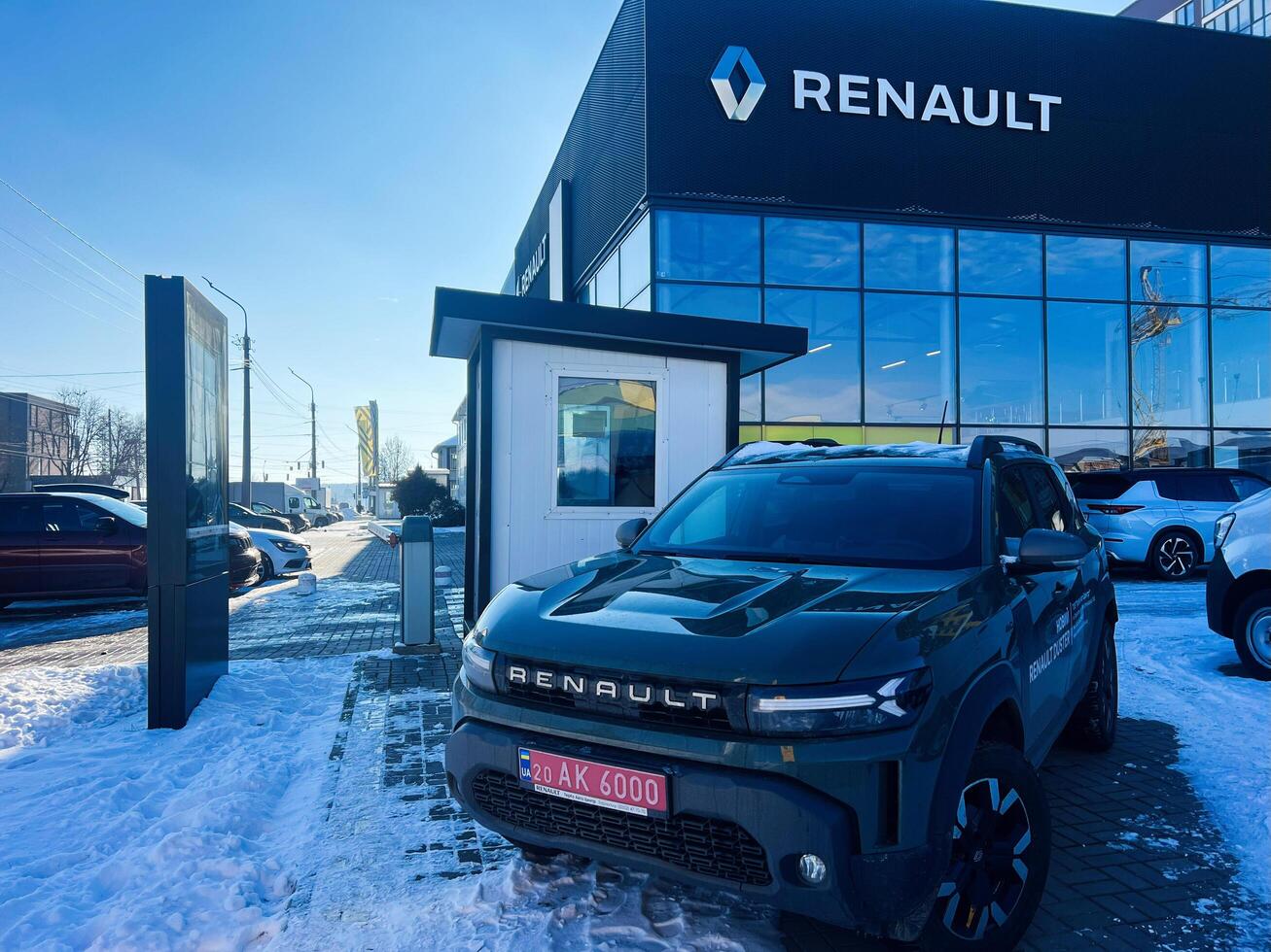 Kyiv, Ukraine - March 04, 2025- Renault dealership exterior with vehicles displayed on a snowy day photo