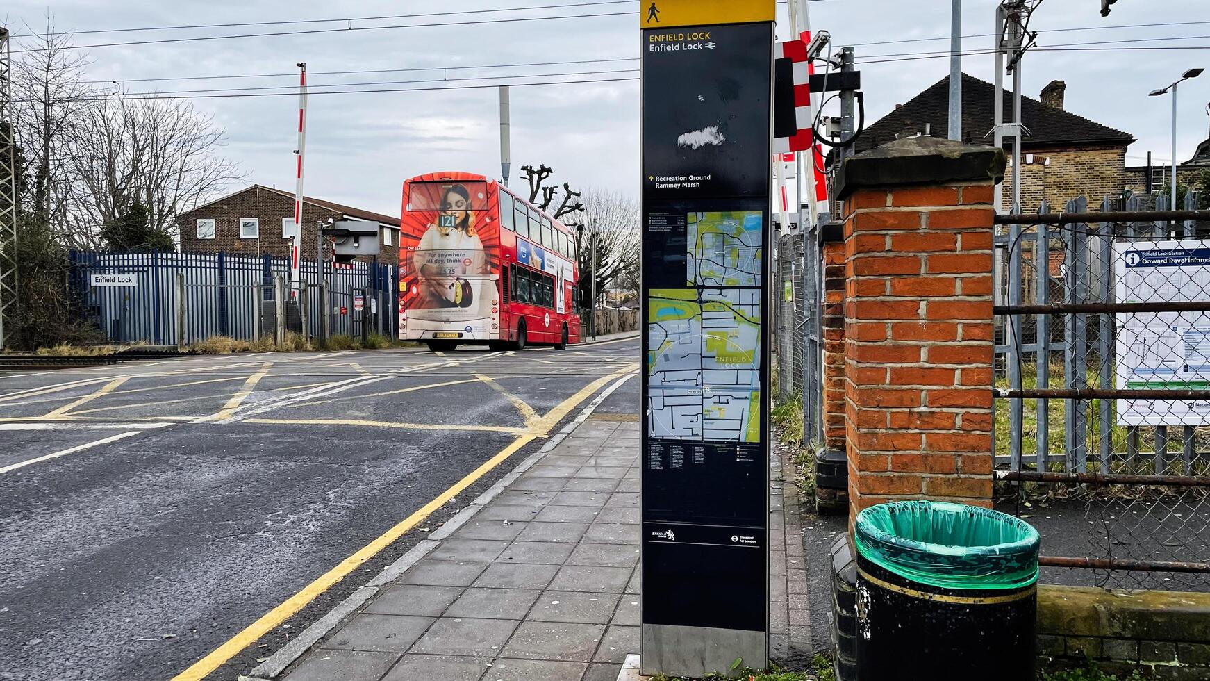 London, UK - March 02, 2025- Urban scene with bus at Enfield Lock crossing in London, UK photo