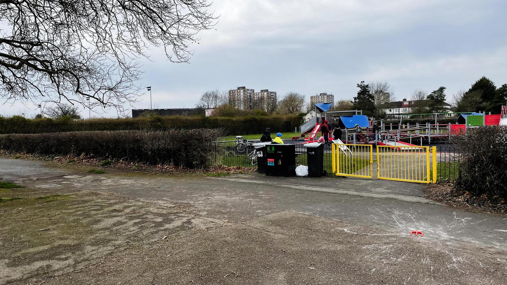 London, UK - March 02, 2025- Outdoor playground in Enfield, London, UK with children and colorful equipment photo