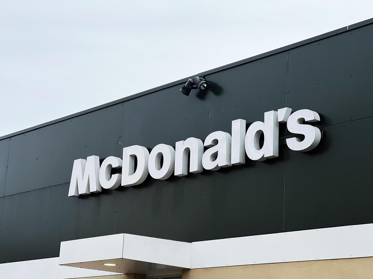 Lviv, Ukraine - March 12, 2025 - McDonald's storefront featuring iconic logo with a modern minimalist design photo