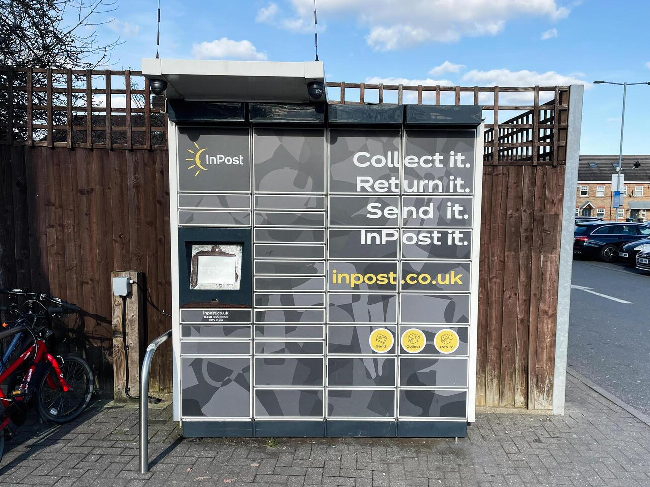 London, UK - March 02, 2025- Outdoor package locker for shipping and delivery with modern interface and branding photo
