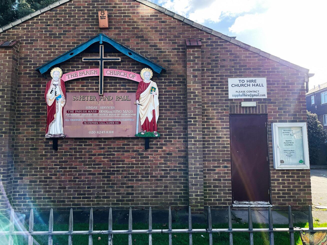 London, UK - March 02, 2025- Exterior view of Ss Peter and Paul church with signage and brick walls photo