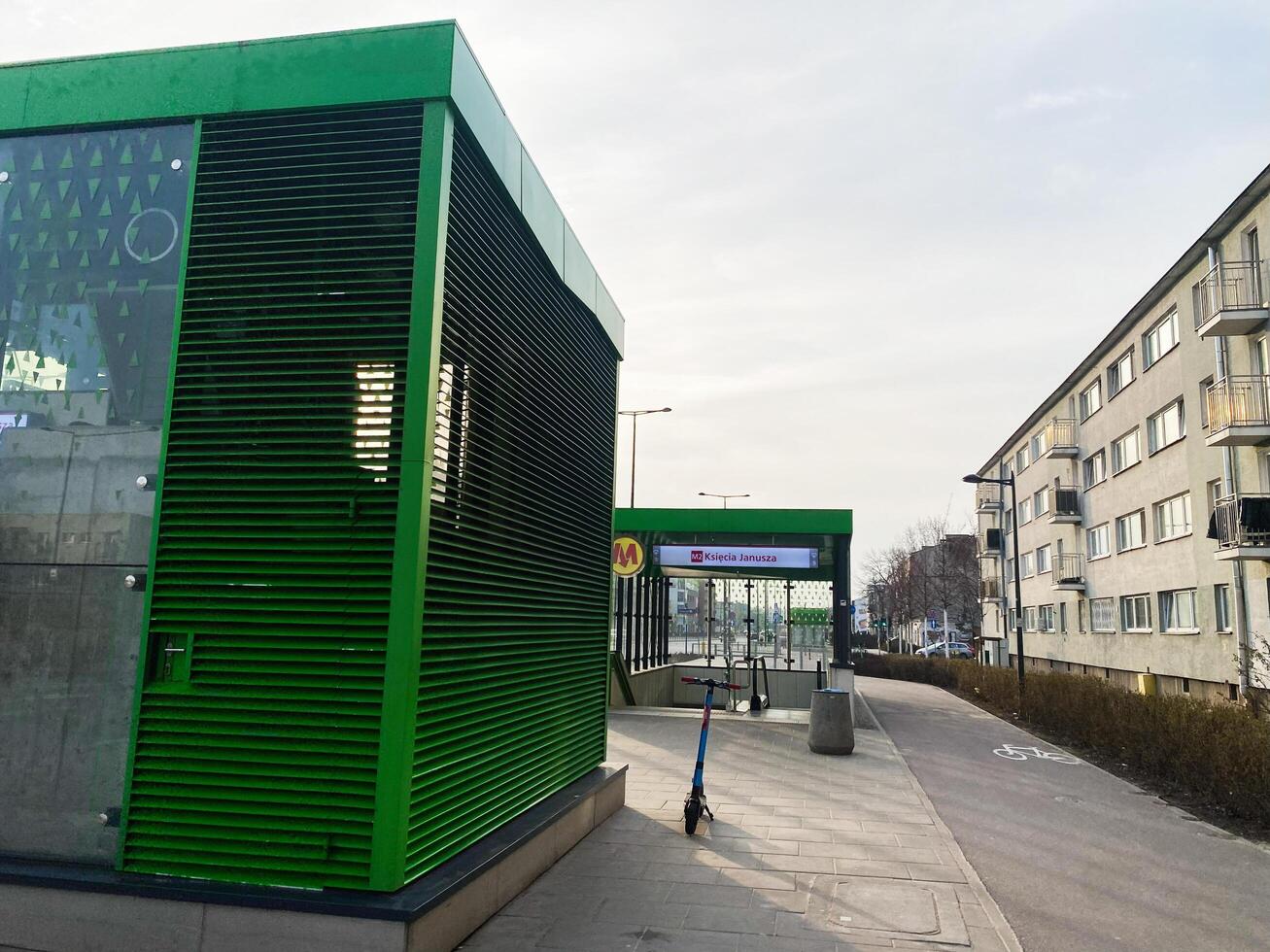 Warsaw, Poland - March 09, 2025 - Modern metro entrance in Warsaw near residential buildings on a sunny day photo