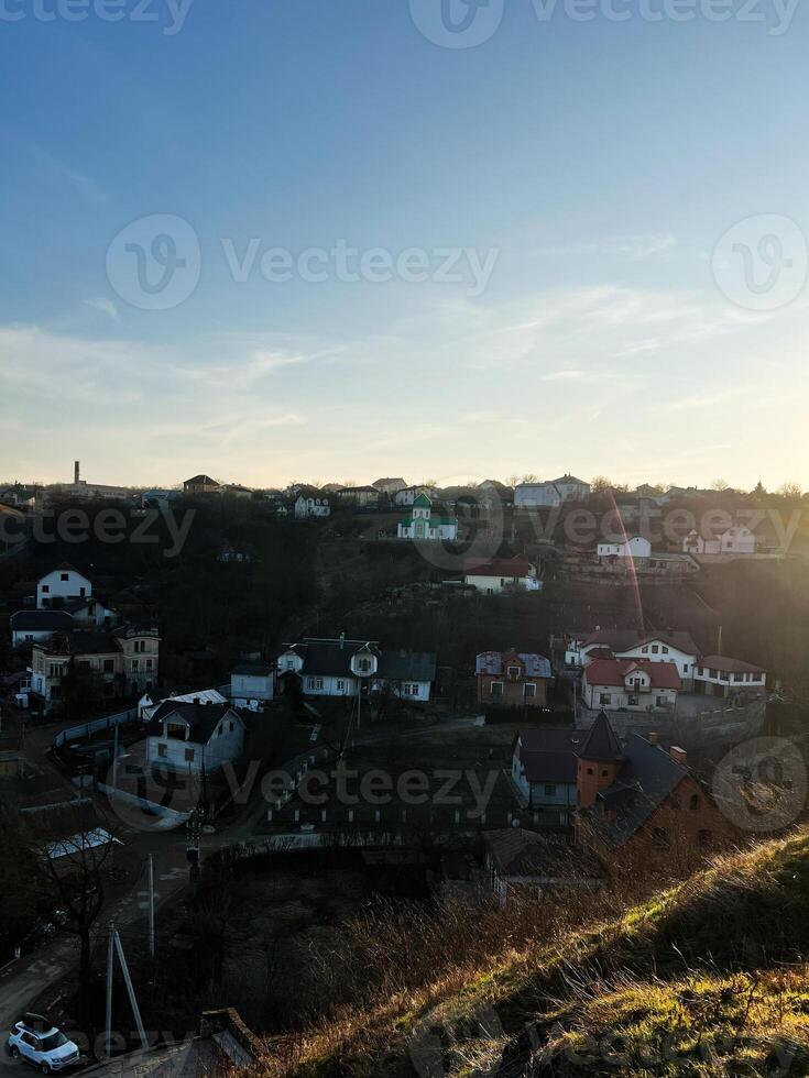 Scenic view of a peaceful village under a vivid blue sky at sunset photo