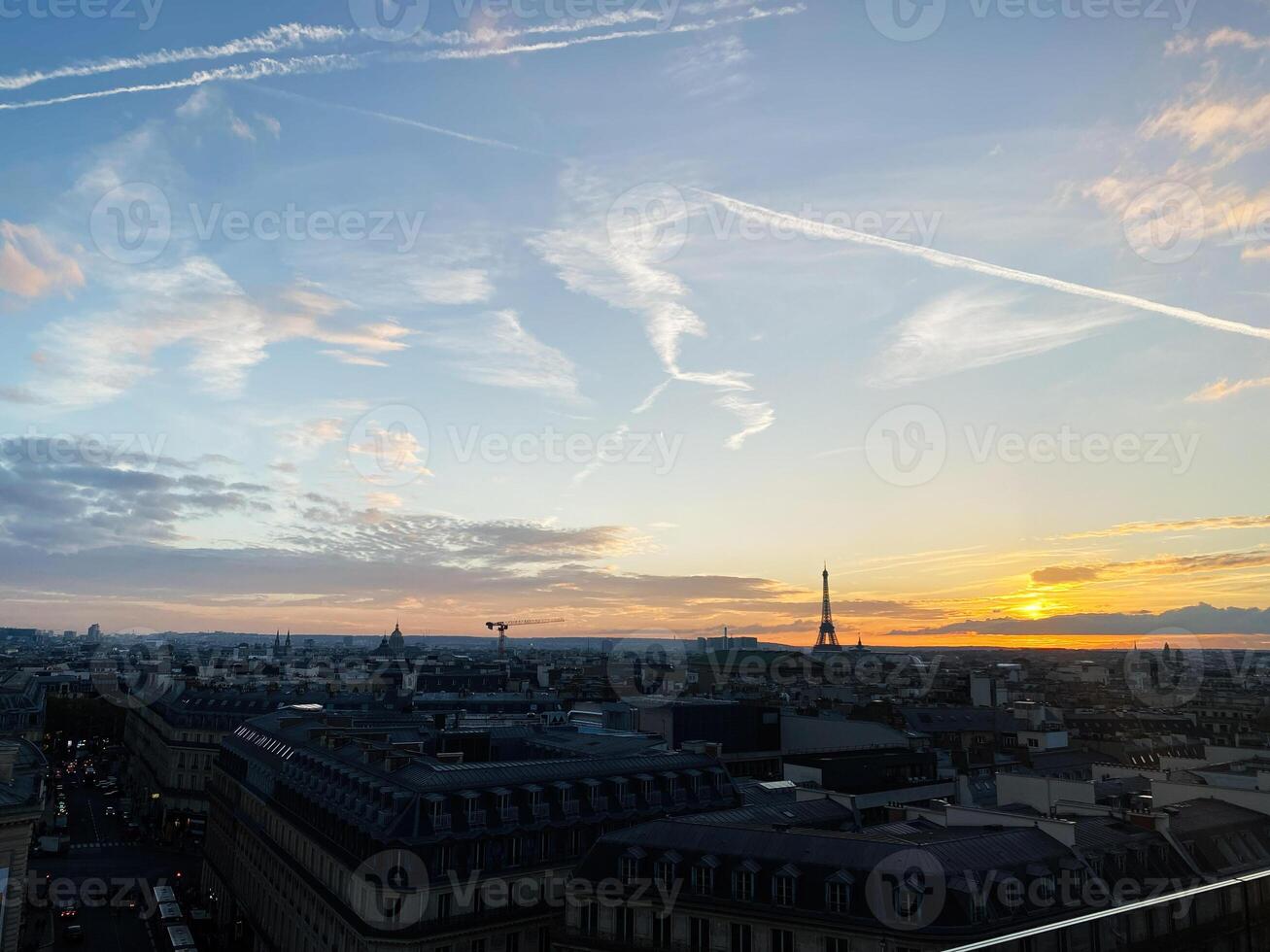 Scenic view of Paris skyline with Eiffel Tower during sunset photo