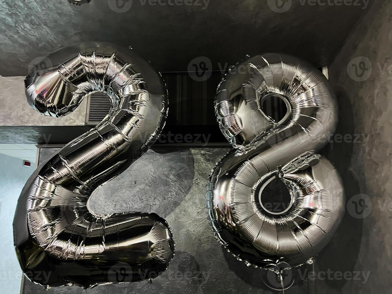 Silver balloons forming the number 28 for a festive celebration photo