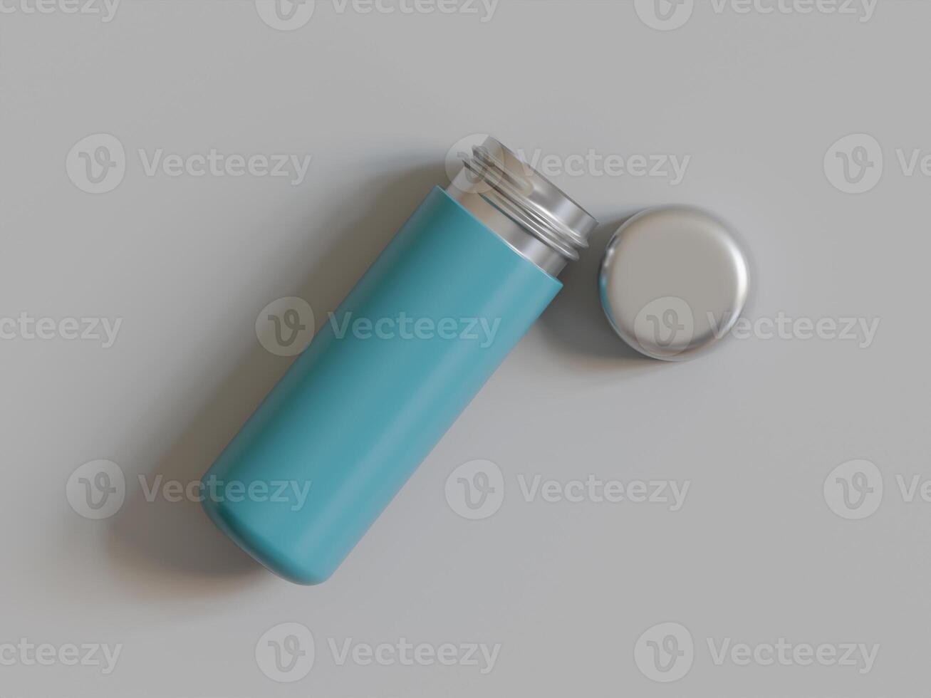 blue insulated bottle lying down lid off grey background soft shadows photo